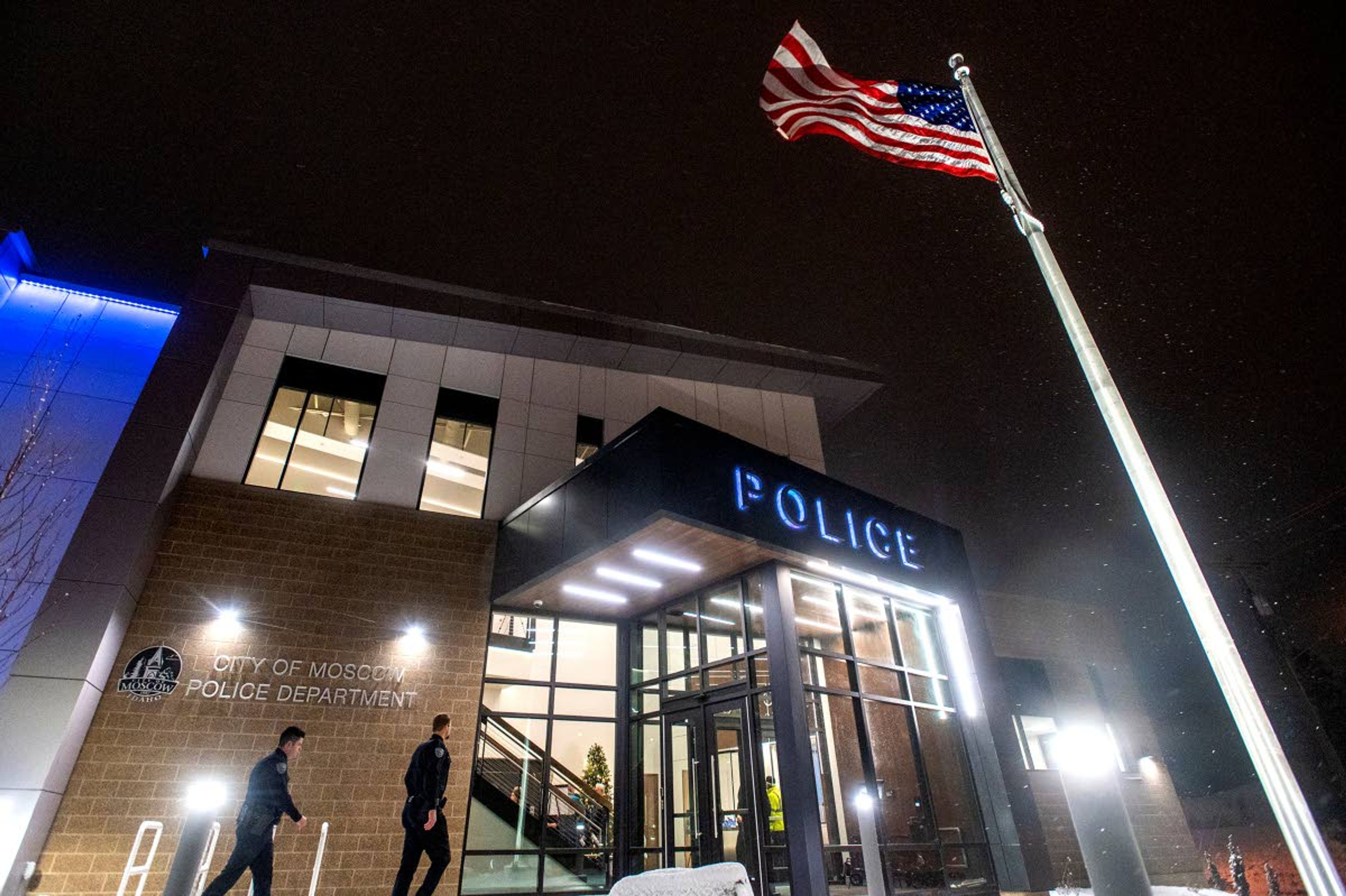 Members of the Moscow Police Department walk Thursday night toward the entrance of the department’s new station located on the corner of Southview Avenue and South Main Street.