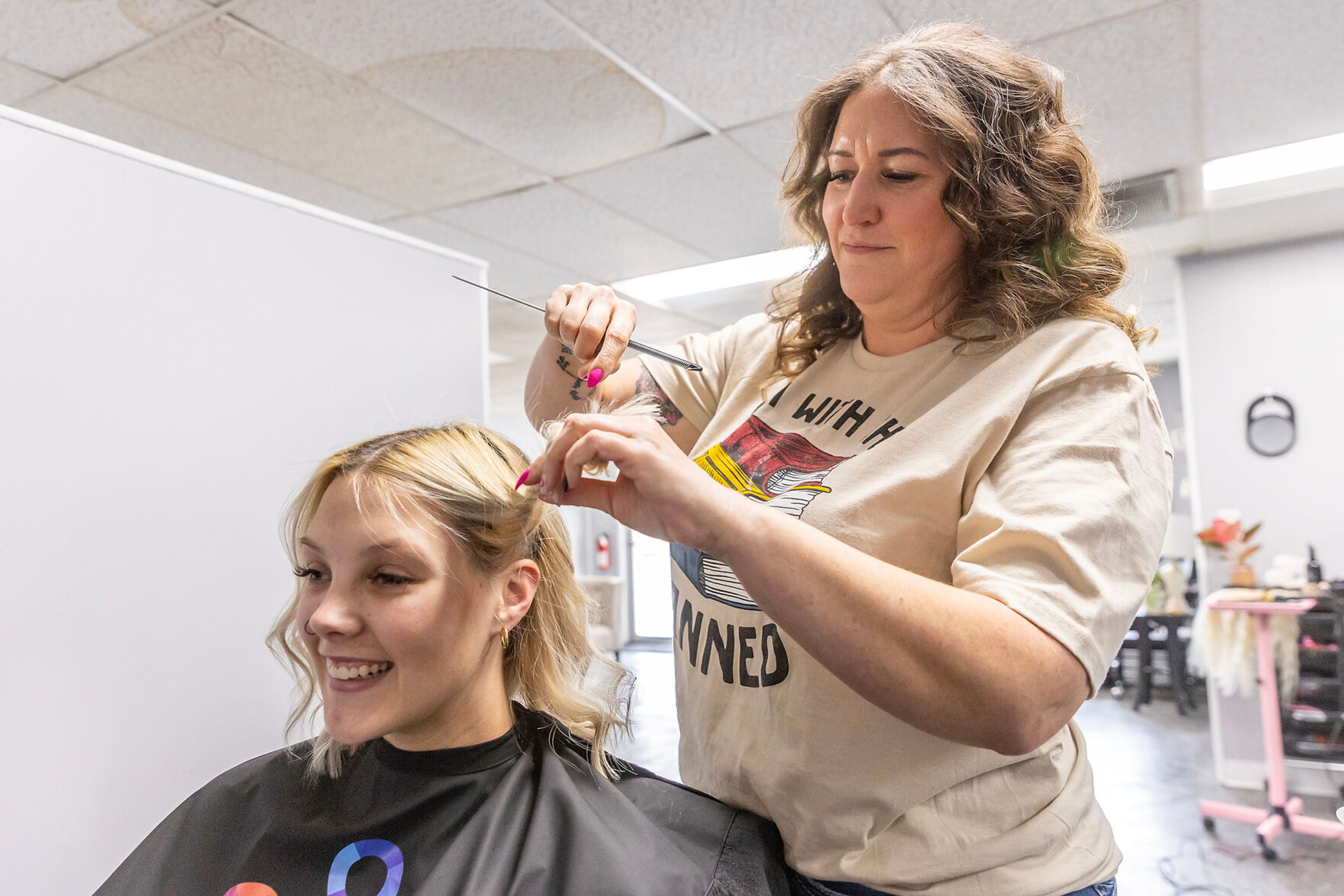 Anna Estrada demonstrates foiling for a photo on Halle Kincaid Wednesday at Style Bar Beauty Academy Wednesday in Lewiston.