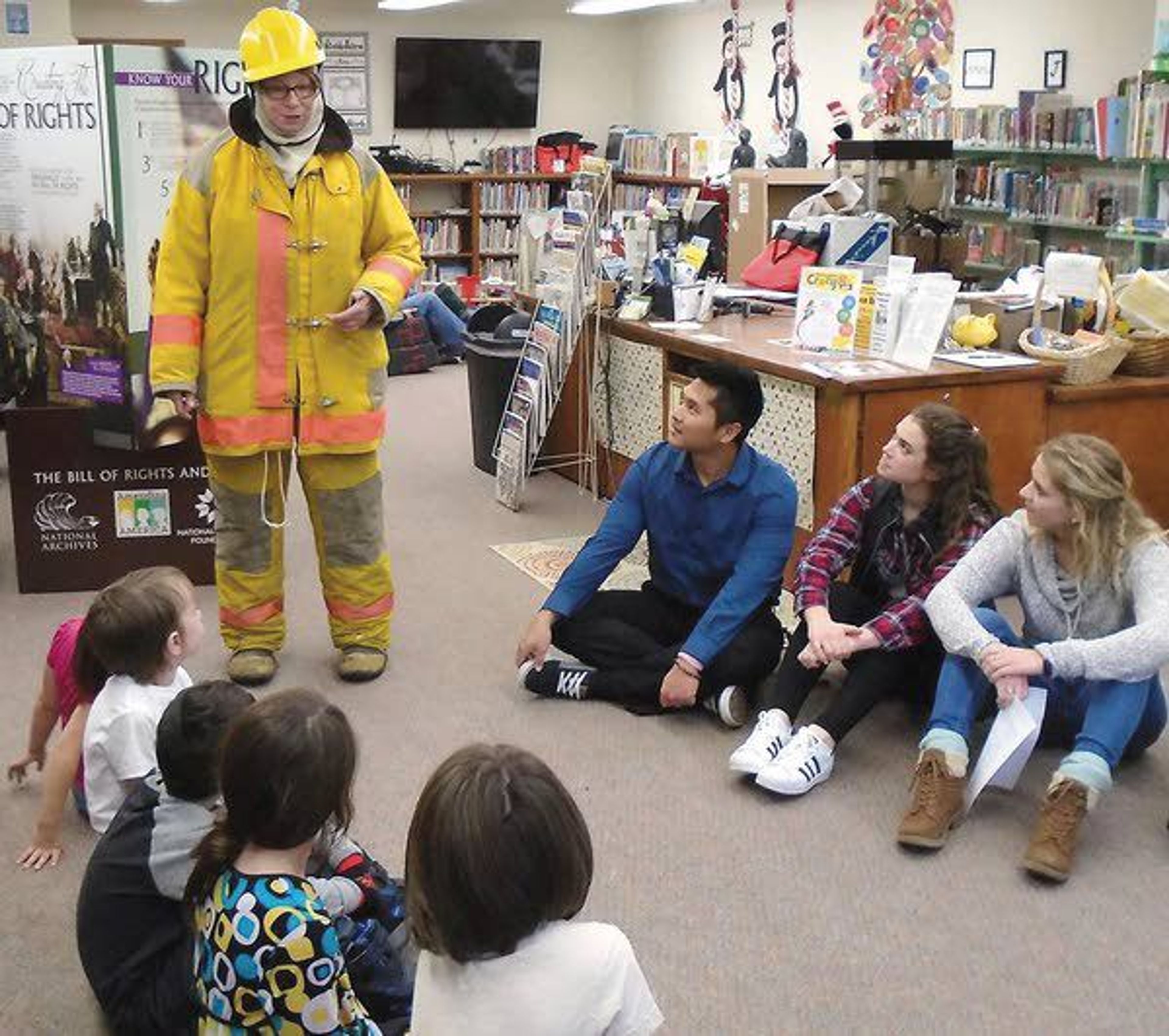 Daily News reader Catalina Flores submitted this photo of Beverly Pearce, Palouse librarian and support crew member for the Wildland Fire, showing her firefighter gear and equipment at Crazy 8s Math Club in Palouse, an afterschool math club designed to get children fired up about math in a whole new, fun, crazy way.