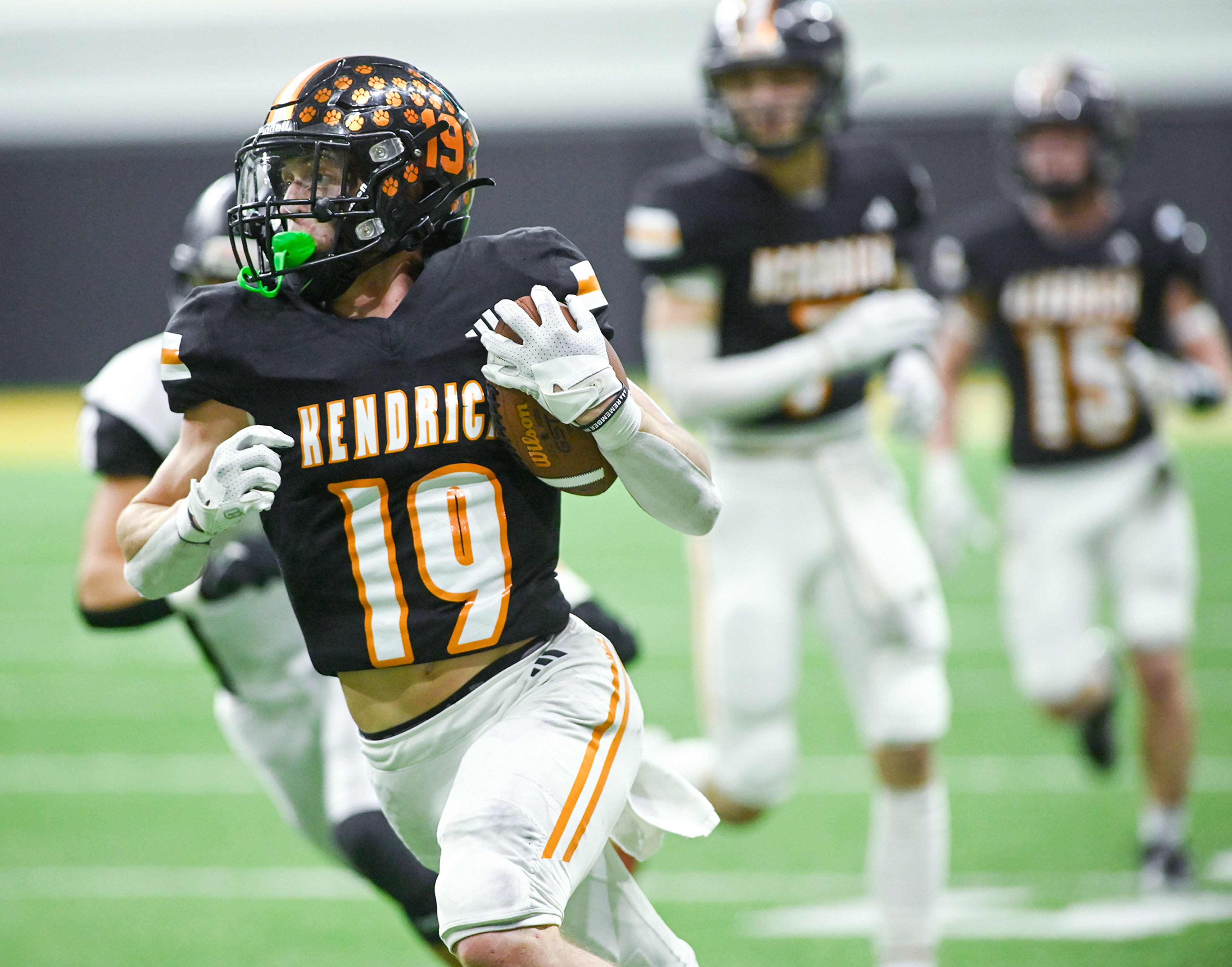 Kendrick’s Sawyer Hewett carries the ball down the field in a breakaway play against Butte County Friday during the Idaho 2A football state championship game at the P1FCU Kibbie Dome in Moscow.