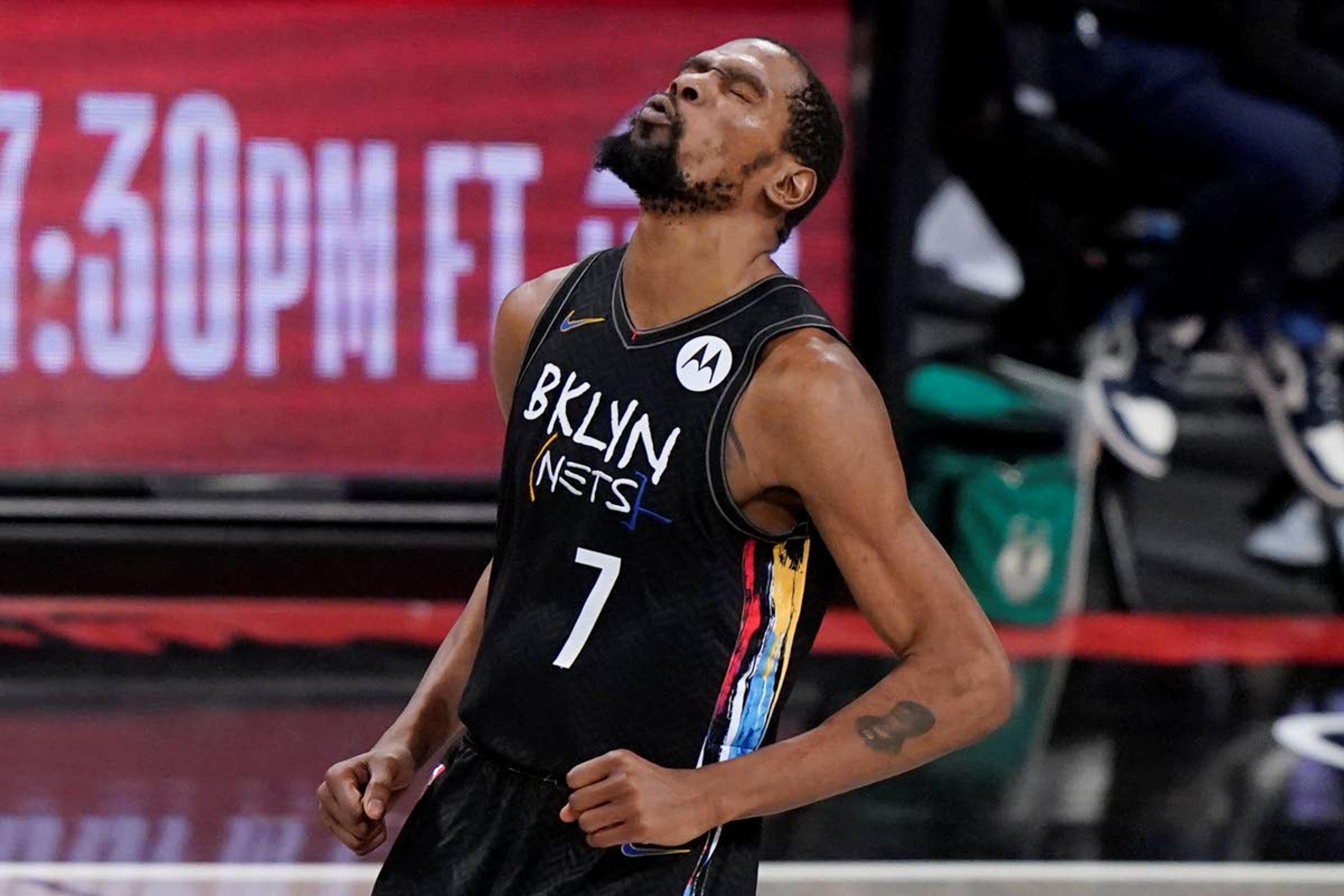 Brooklyn Nets forward Kevin Durant reacts after sinking a 3-point shot against the Milwaukee Bucks during the fourth quarter of Game 5 of a second-round NBA basketball playoff series Tuesday, June 15, 2021, in New York. (AP Photo/Kathy Willens)