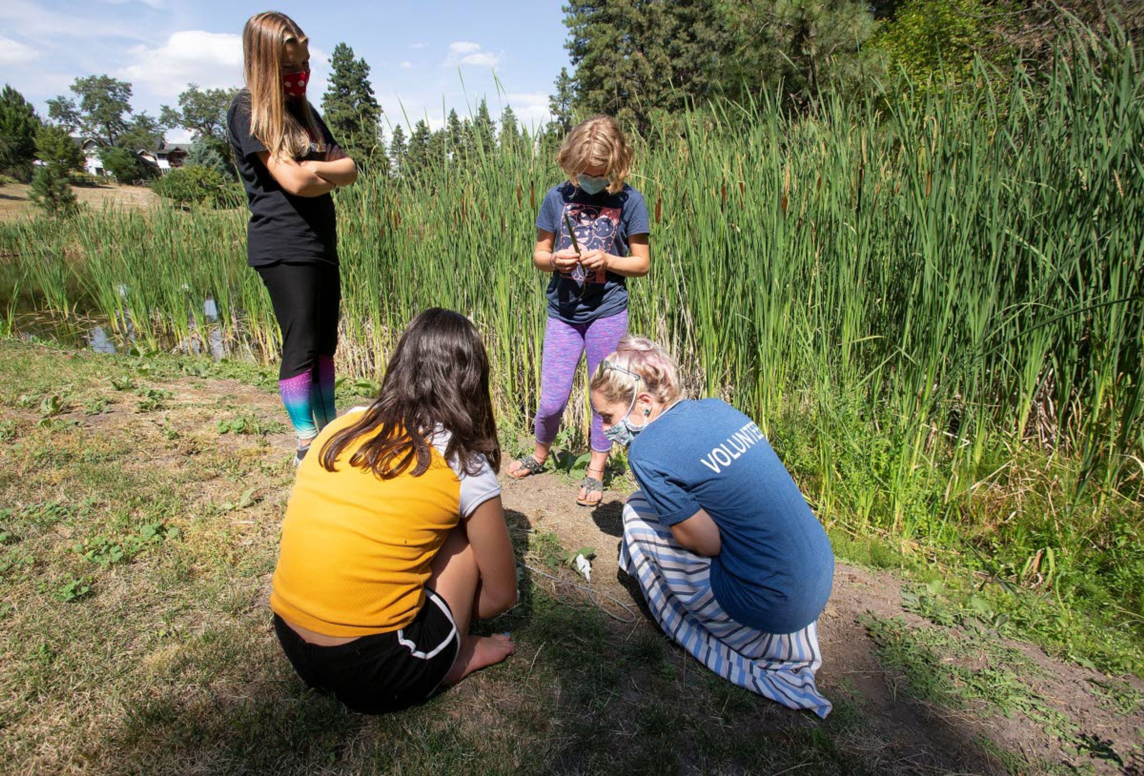 Maegan Canha, right, teaches students how to measure the transpiration properties of a leaf Tuesday during a Soils STREAM Team class. Canha is the laboratory manager at the METER Group in Pullman.