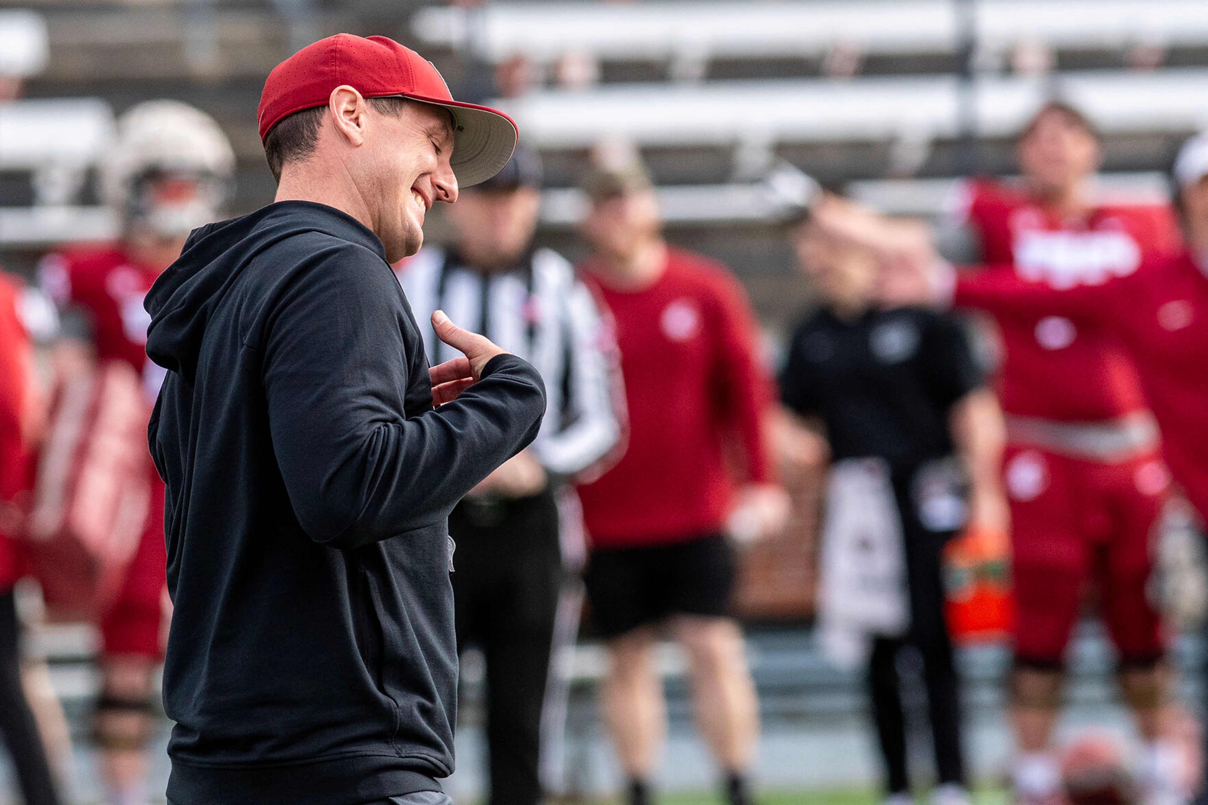 Jake Dickert reacts after tossing a bad snap back to the quarterback in a quarter of the Crimson and Gray Game at Washington State University in Pullman.