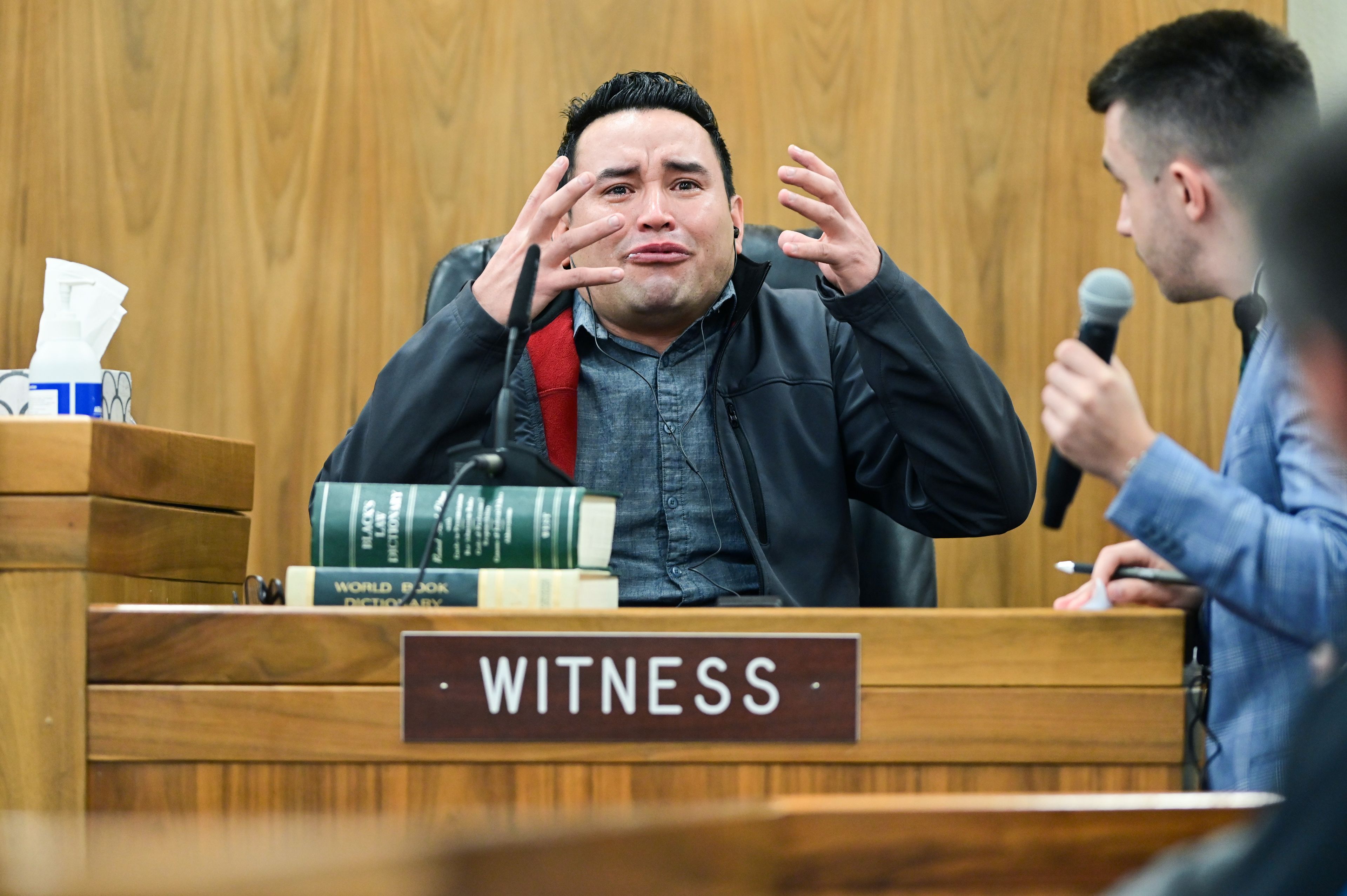 Juan Trejo Perez motions with his hands during testimony in his felony third-degree child molestation trial, where he described how his face looked after being punched in the fall. Trejo Perez was found guilty by a jury, and will be sentenced at a later date.