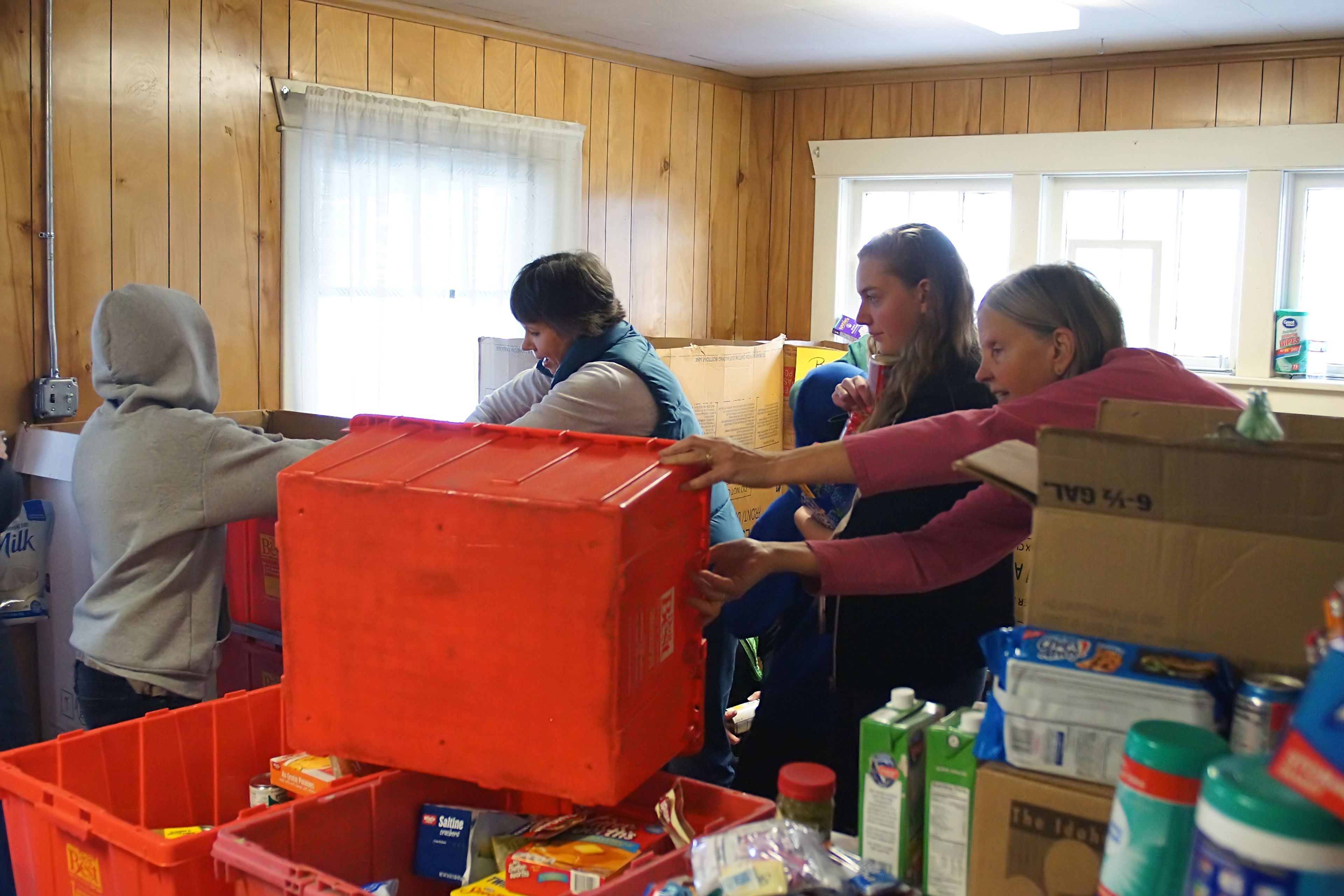 Volunteers sort food Saturday at the Moscow Food Bank during the 13th annual Palouse Cares Food Drive and Auctions.