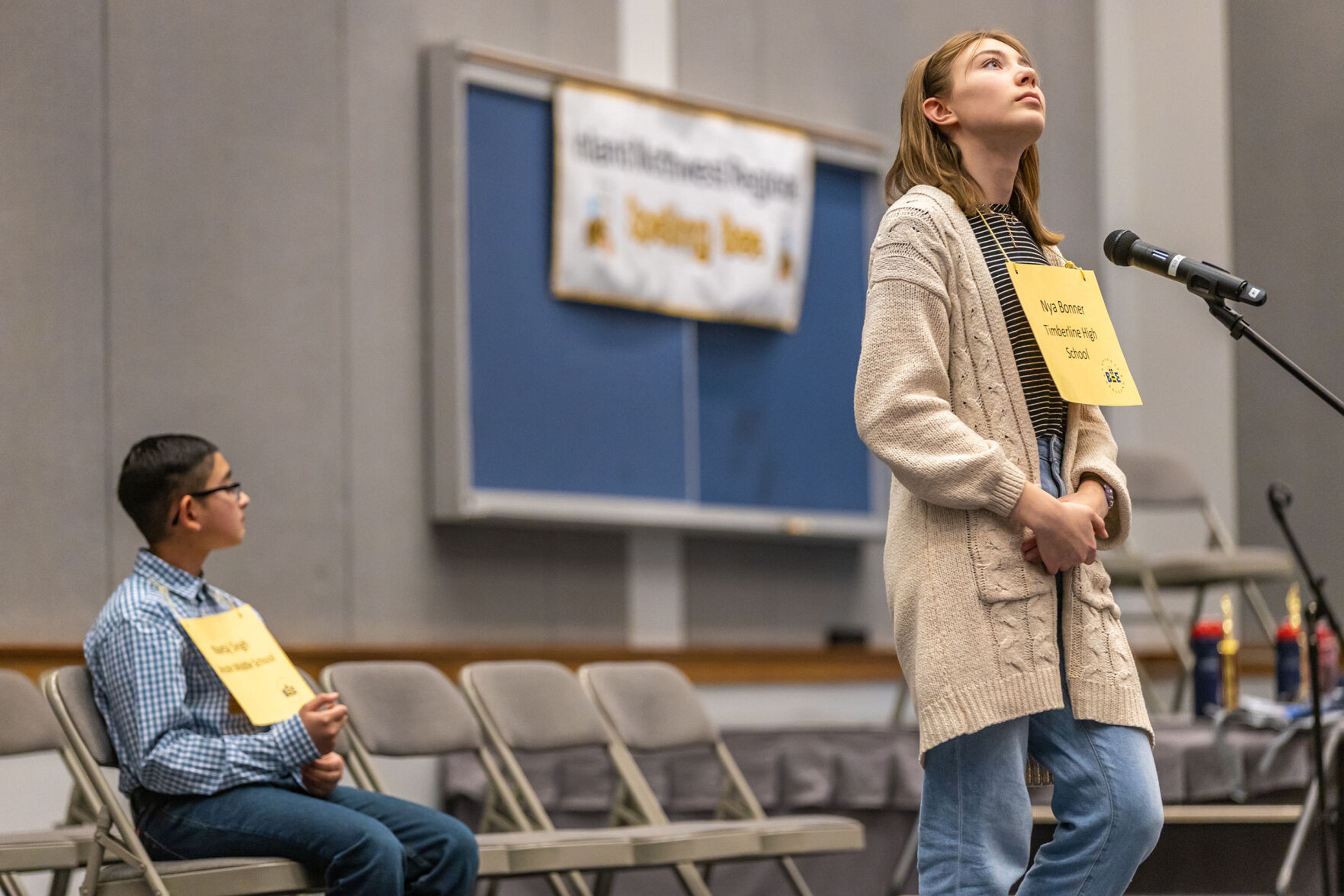 Nya Bonner, right, of Timberline High School, concentrates on the spelling of her next word Saturday during the Inland Northwest Regional Spelling Bee at Lewis-Clark State College in Lewiston. Bonner took second place after a back-and-forth battle with the regional reigning spelling champion Navtaj Singh.