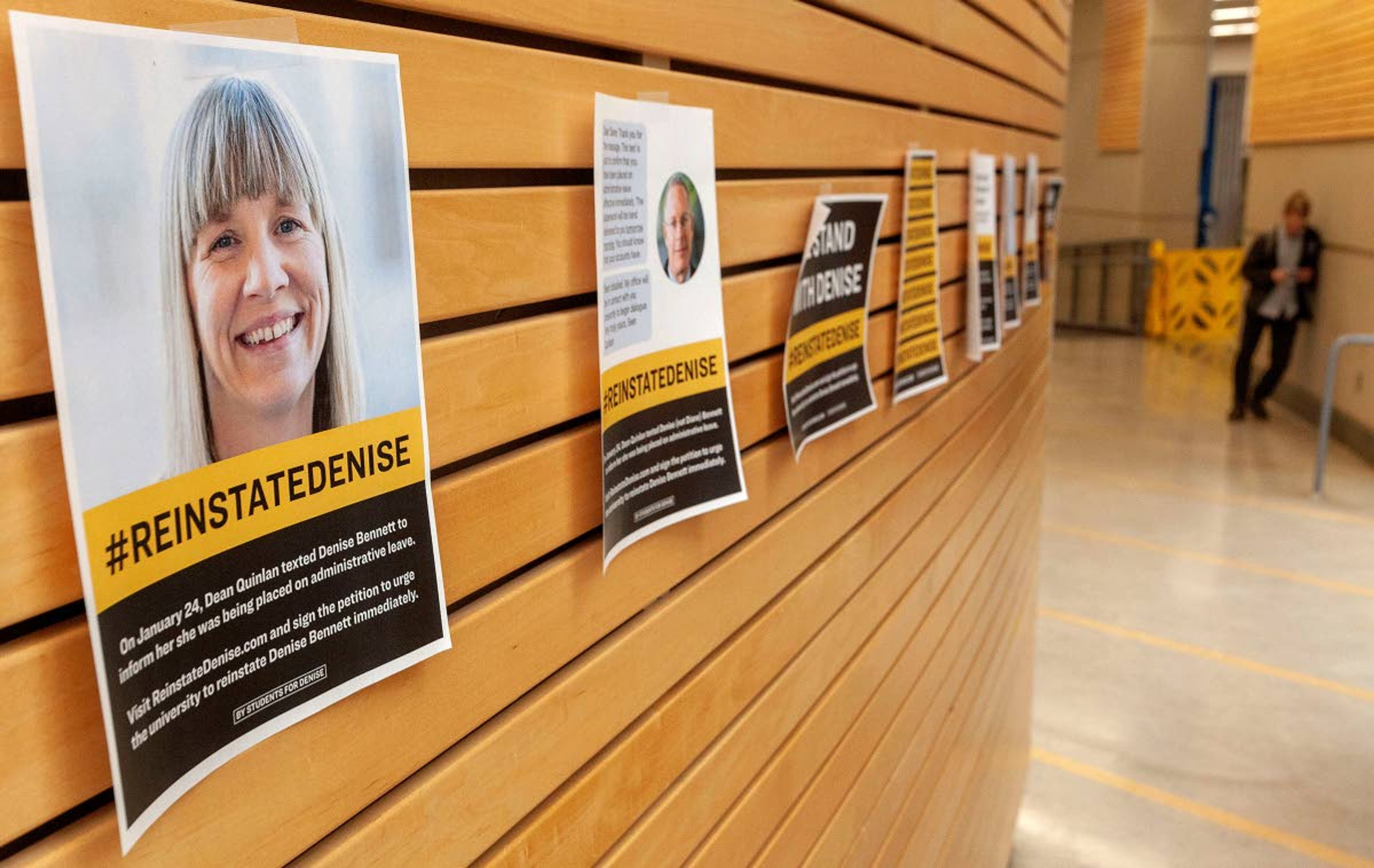 Flyers in support of University of Idaho Associate Professor Denise Bennett hang on a bulletin board at the Idaho Commons on Monday in Moscow.