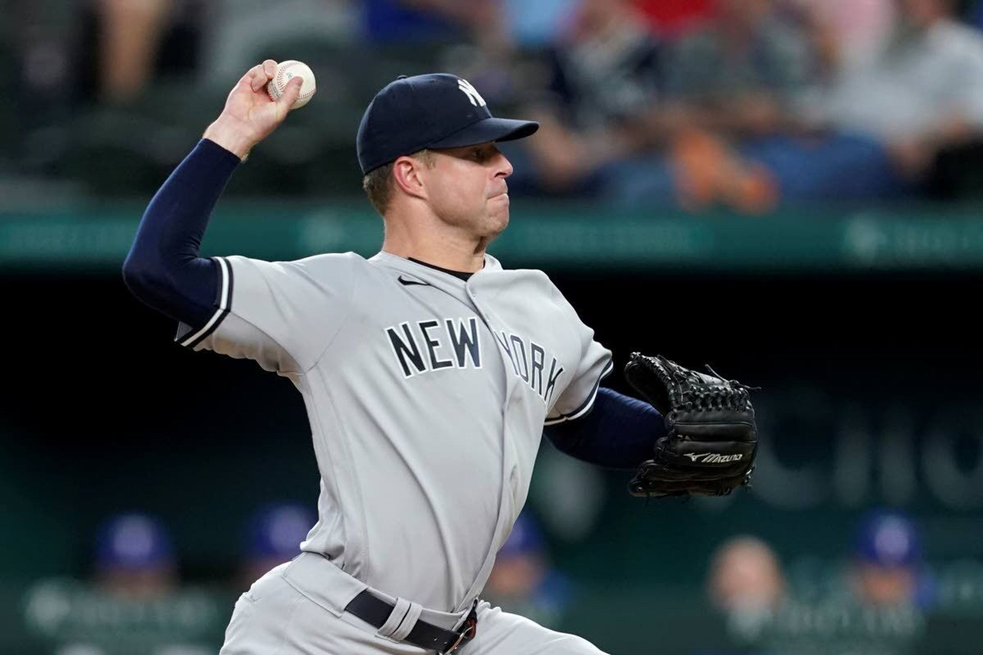 New York Yankees starting pitcher Corey Kluber throws to a Texas Rangers batter during the first inning of a baseball game in Arlington, Texas, Wednesday, May 19, 2021. (AP Photo/Tony Gutierrez)