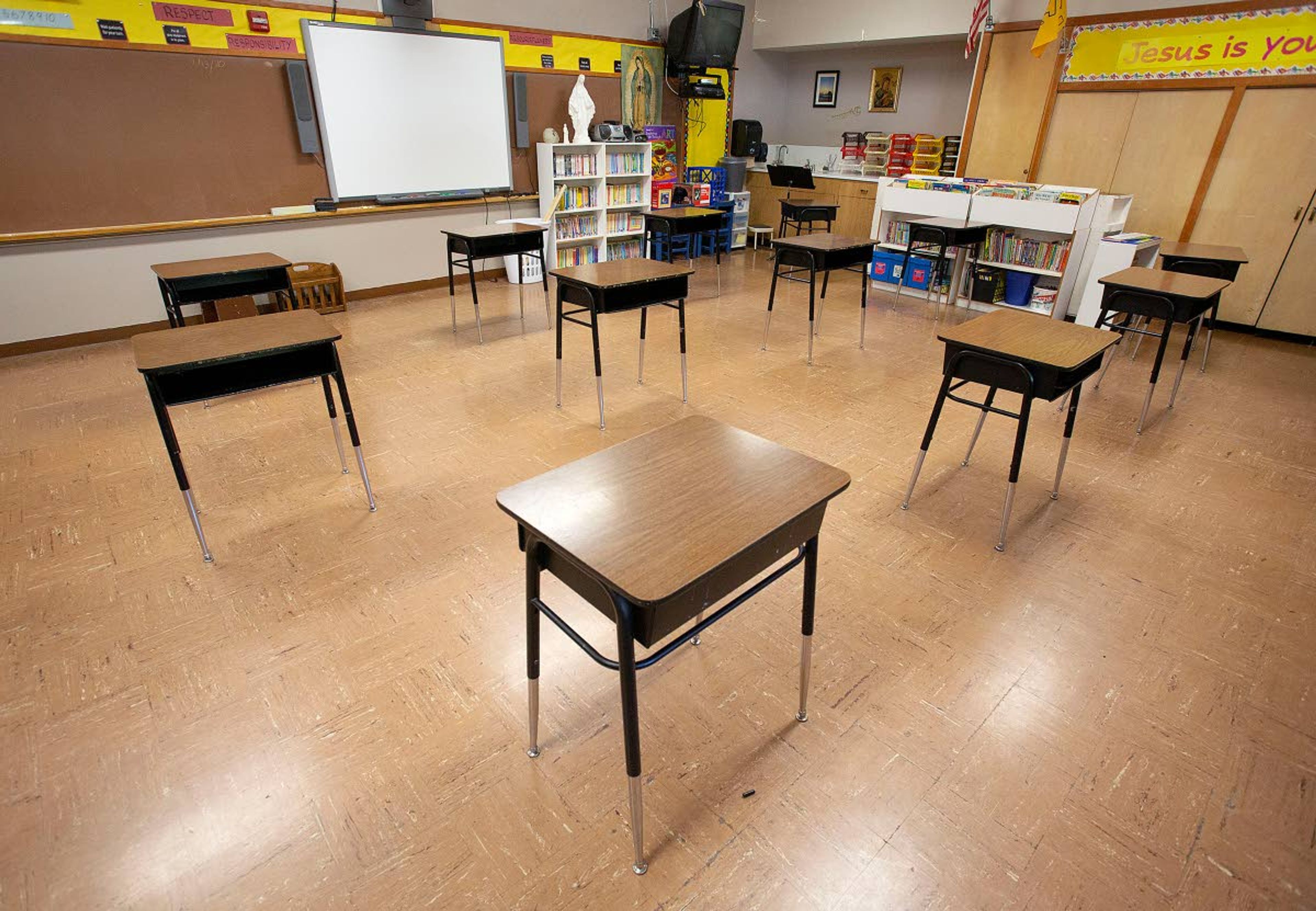 Desks are spaced six feet apart in a second-grade classroom on Monday at Saint Mary's School in Moscow. Teachers are rearranging their classroom so desks will be at least six feet apart to help prevent the spread of the coronavirus.