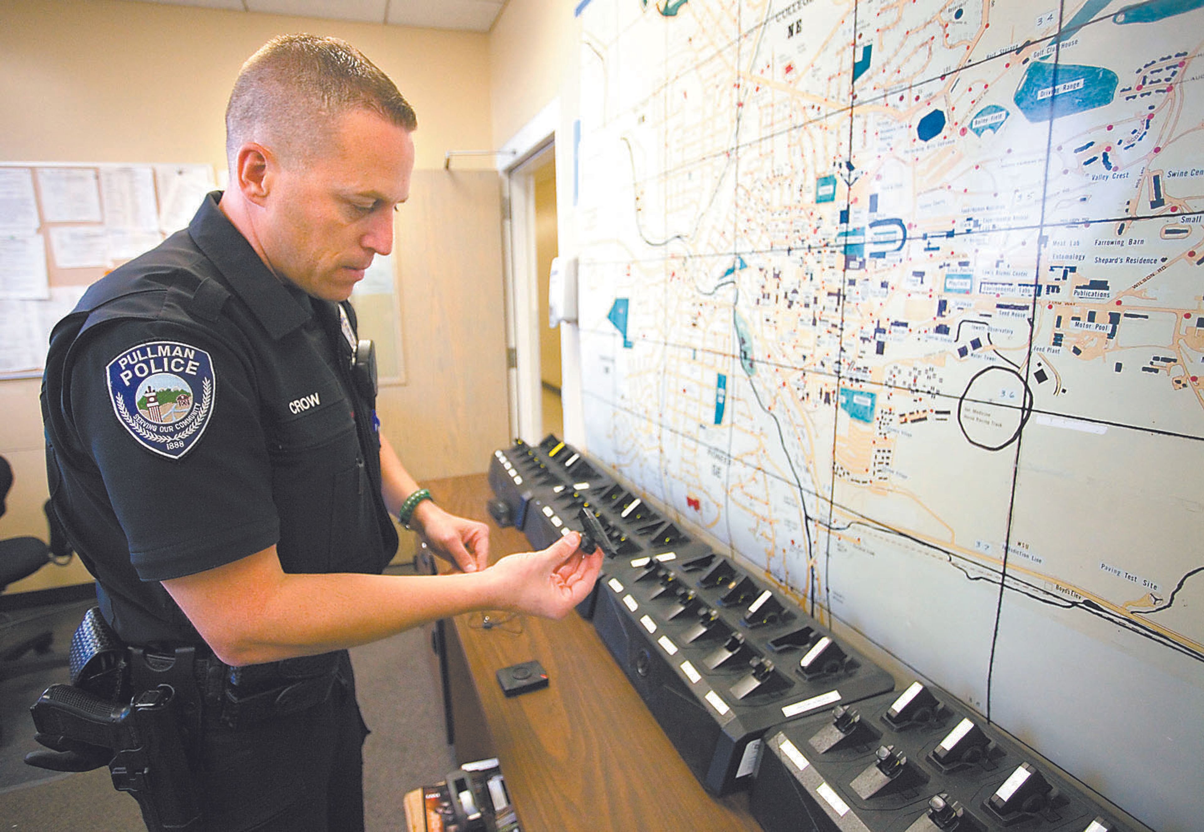 Pullman police officer Mike Crow talks about the body camera he wears while on duty at the police station on Friday.