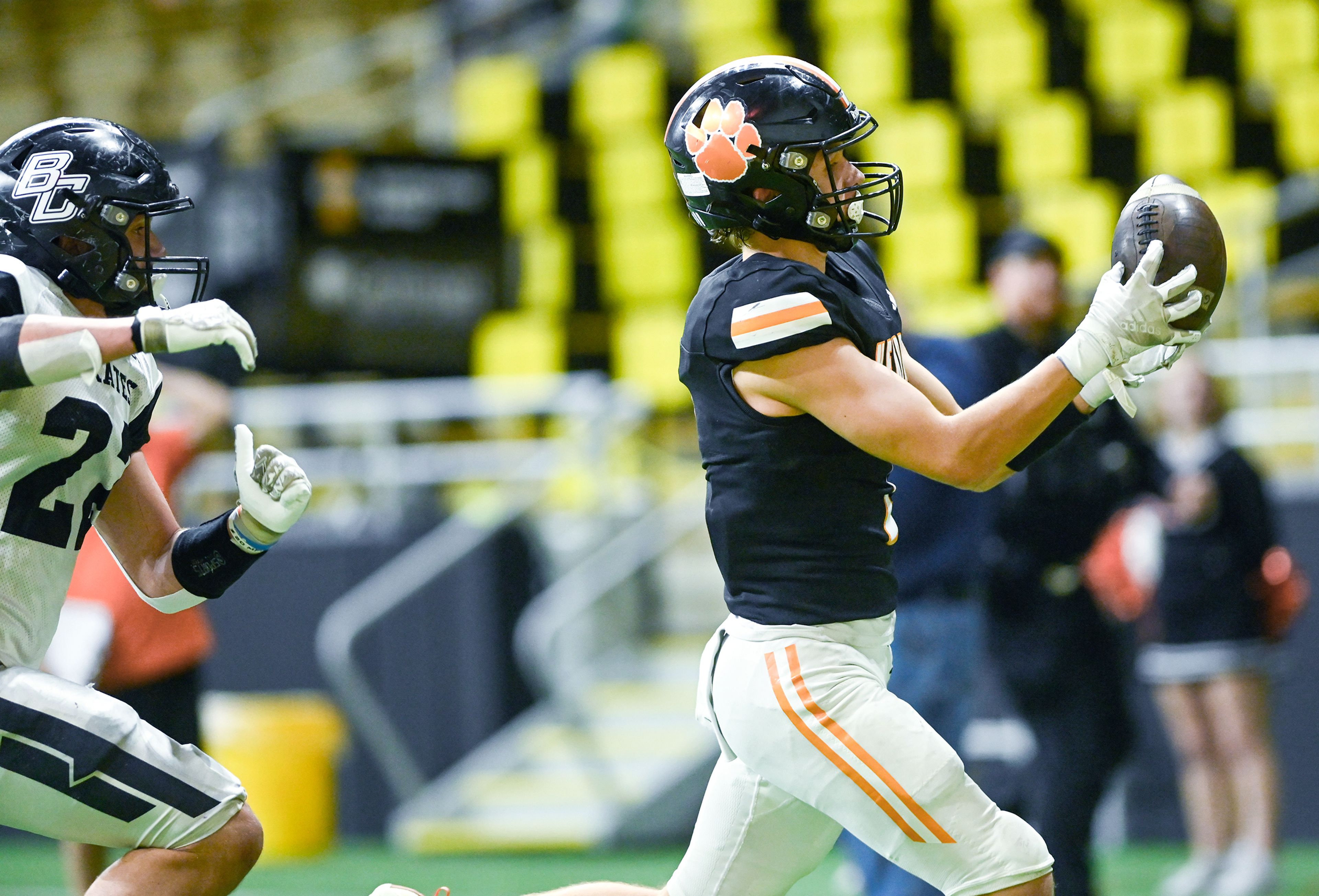 Kendrick’s Ralli Roetcisoender catches the ball, carrying it into the end zone for a touchdown against Butte County Friday during the Idaho 2A football state championship game at the P1FCU Kibbie Dome in Moscow.