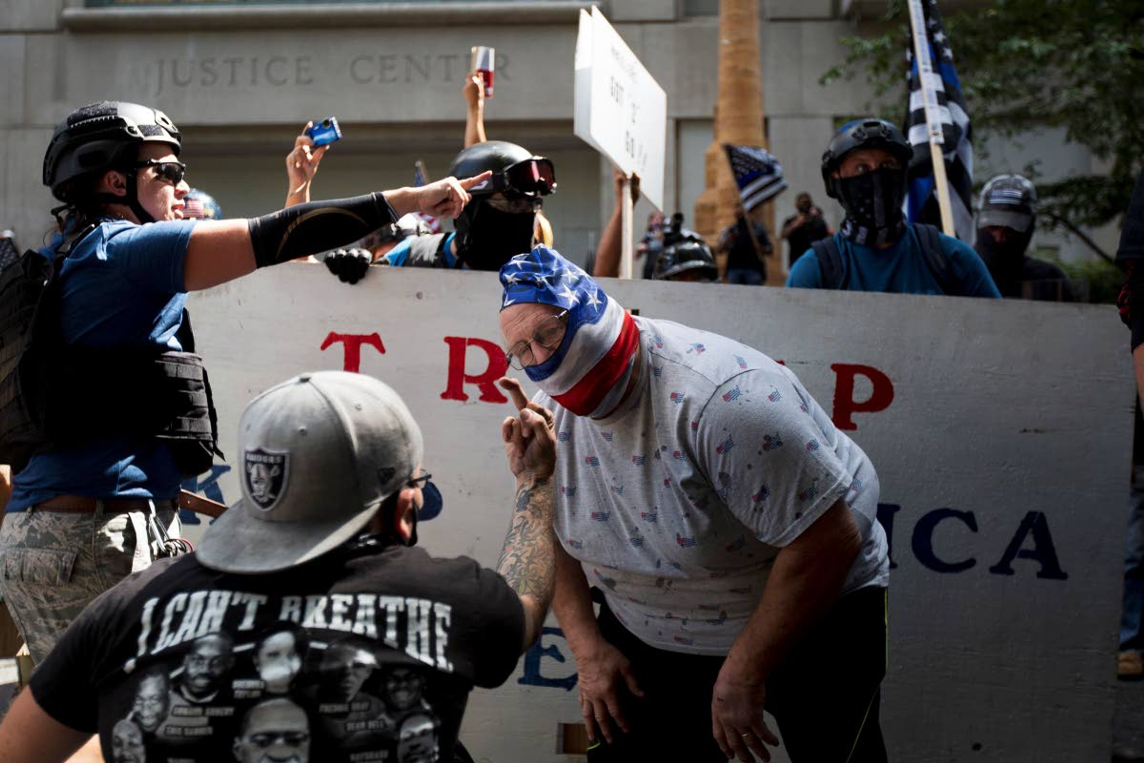 Brooke Herbert/The Oregonian via APFar-right demonstrators, with the stated goal of “Saying No to Marxism,” gather at the Justice Center in Portland, Ore., Saturday, drawing multiple counter-protests from left-wing, anti-fascist groups and Black Lives Matter groups.