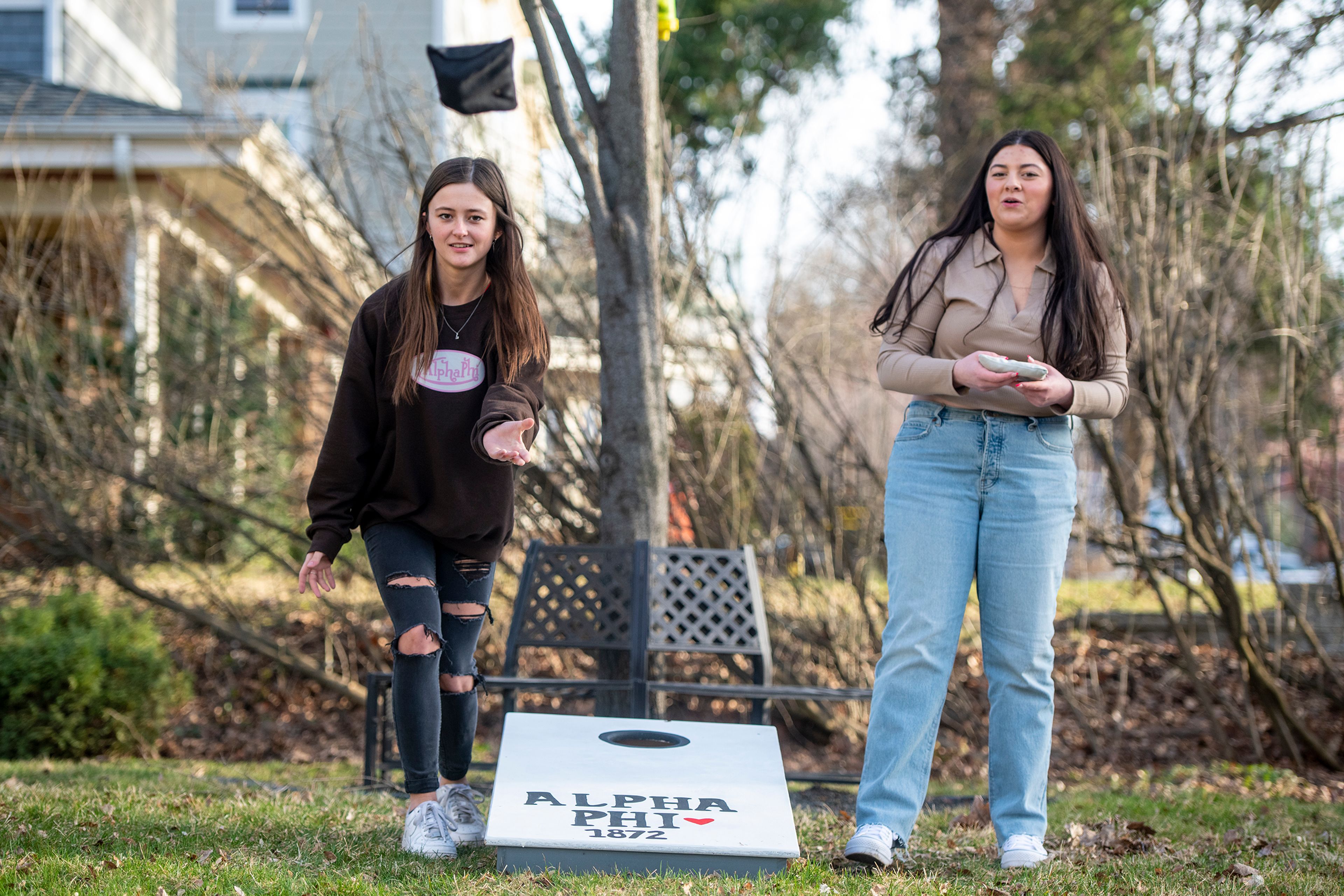 Sydnie Roberds, left, and Kendyll Quintano of University of Idaho’s Alpha Phi sorority play cornhole in preparation of this weekend’s UIdaho Bound event, which features campus tours as well as a fraternity and sorority social. “It’s the first UIdaho Bound we’ve had in a couple years that won’t be virtual. A lot of people in this house have never experienced it before so it should be a lot of fun,” Roberds said.