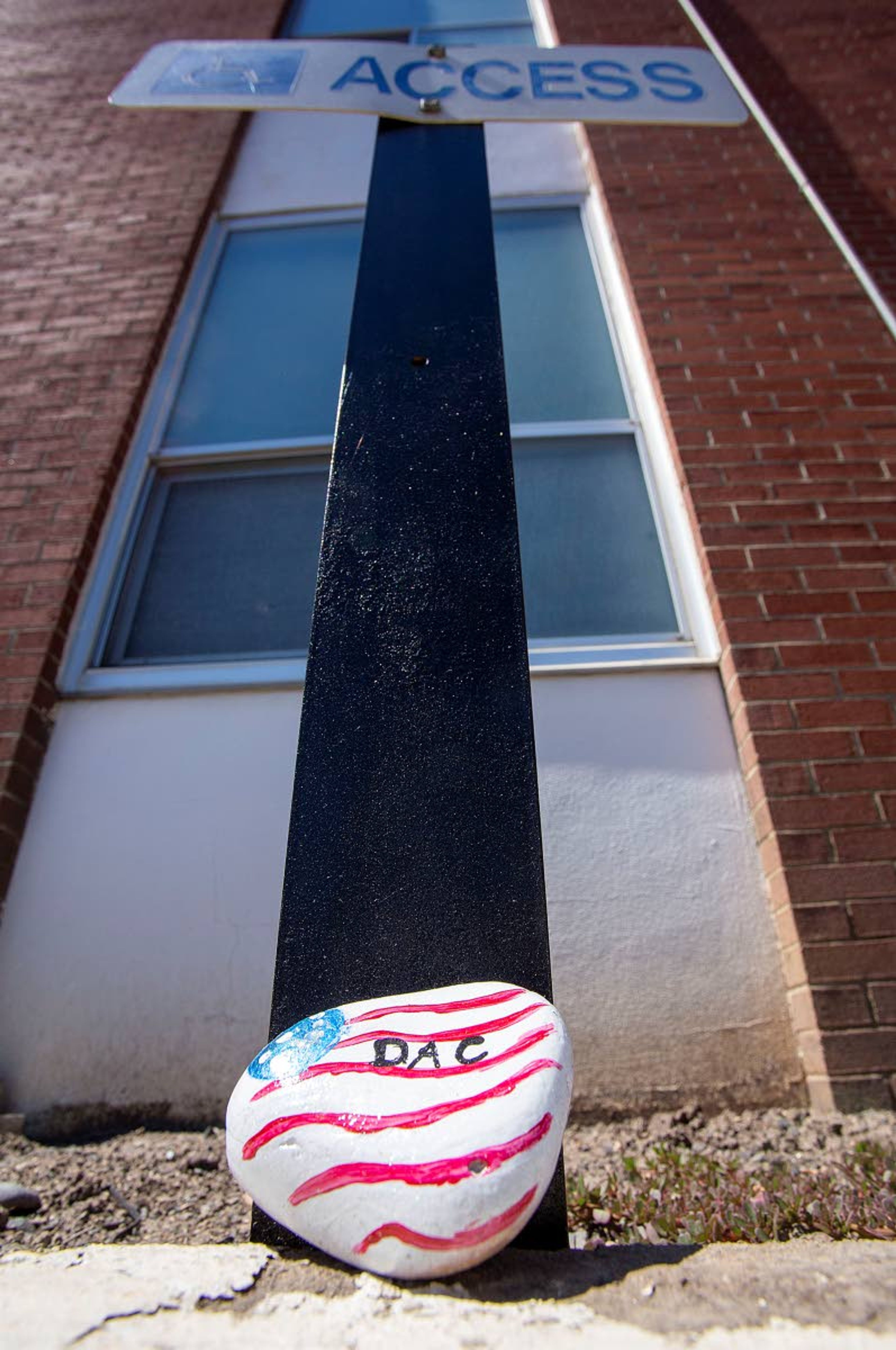 A rock placed by the Disability Action Center Northwest marks a wheelchair accessible entrance to the Latah County Courthouse on Tuesday in Moscow.