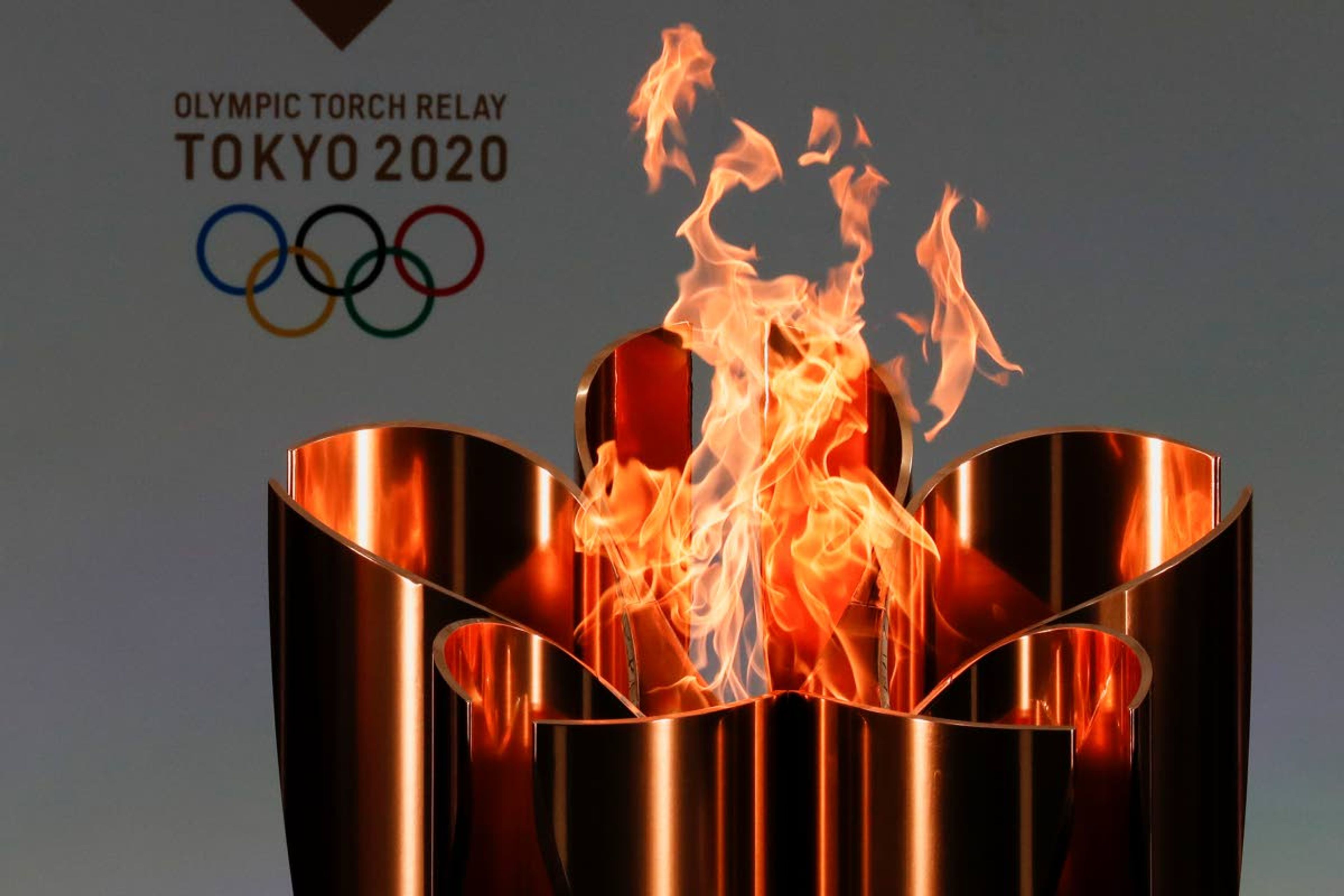 FILE - In this March 25, 2021, file photo, the celebration cauldron is seen lit on the first day of the Tokyo 2020 Olympic torch relay in Naraha, Fukushima prefecture, northeastern Japan. IOC officials say the Tokyo Olympics will open on July 23 and almost nothing now can stop the games from going forward. (Kim Kyung-Hoon/Pool Photo via AP, File)