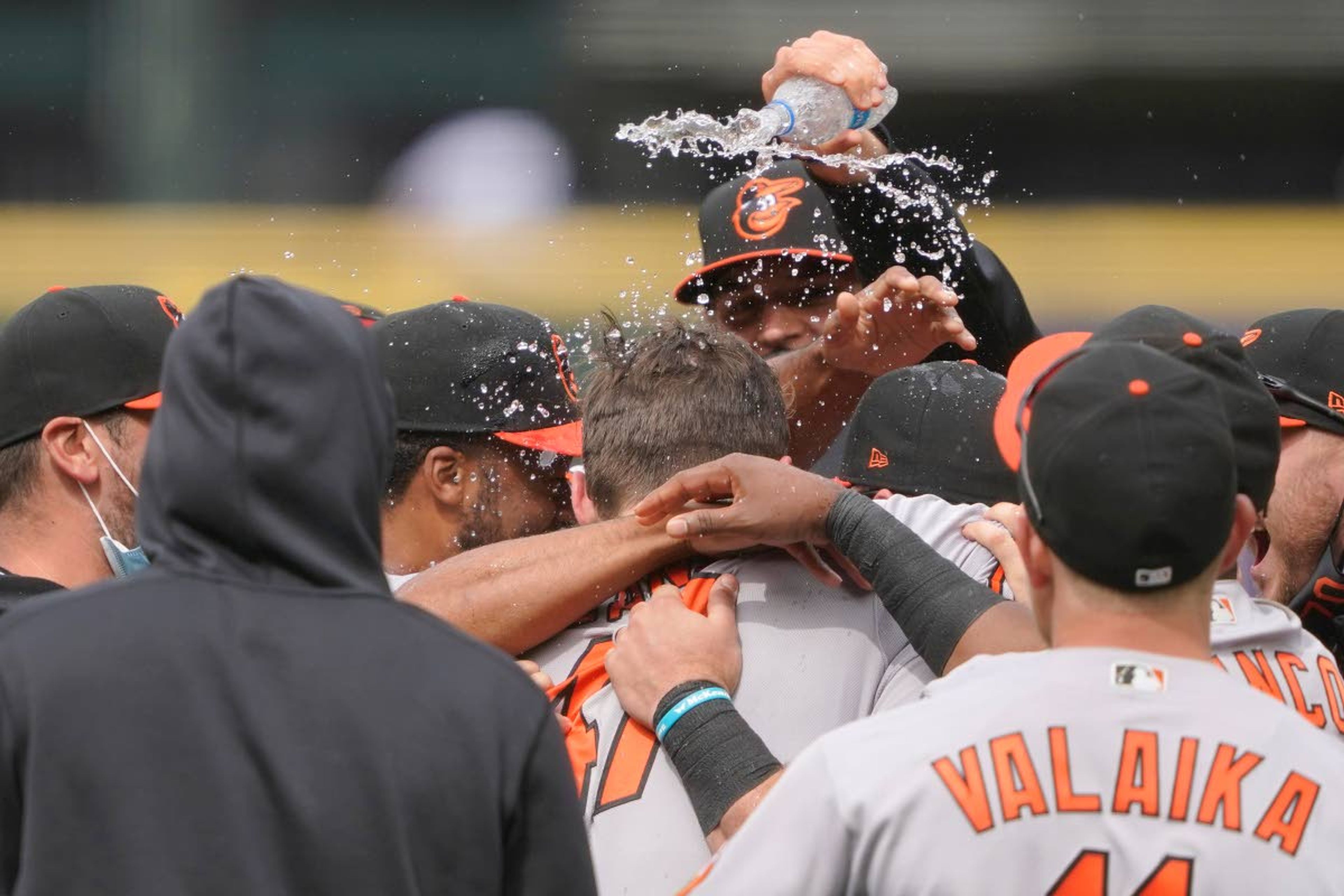 Baltimore Orioles starting pitcher John Means is mobbed by teammates and has water dumped on him after he threw a no-hitter baseball game against the Seattle Mariners, Wednesday, May 5, 2021, in Seattle. The Orioles won 6-0. (AP Photo/Ted S. Warren)