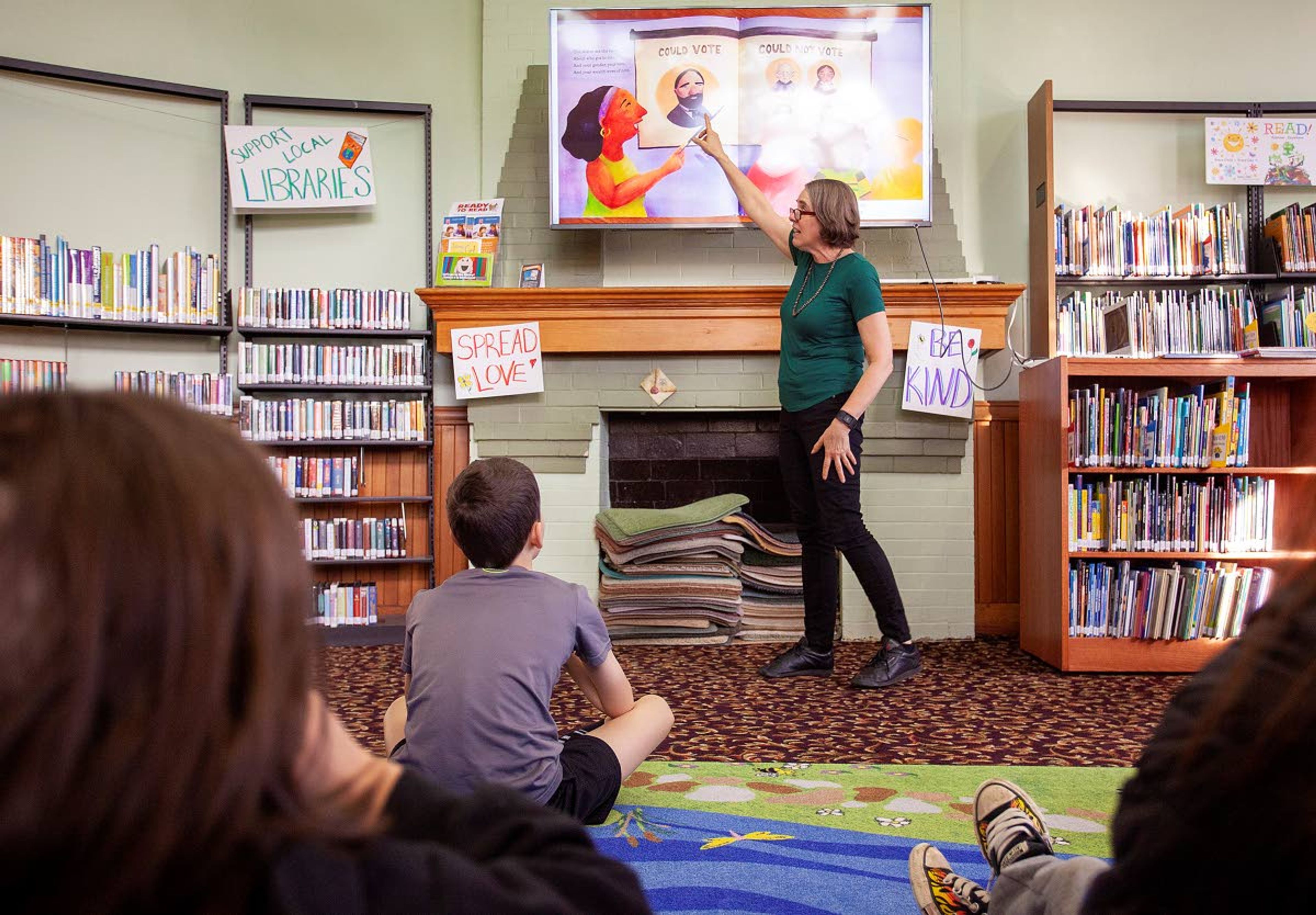 Moscow author Annette Bay Pimentel reads children a book about an activist during “Shape The Future: A Kids Intro To Activism” on Tuesday at the Moscow Public Library.