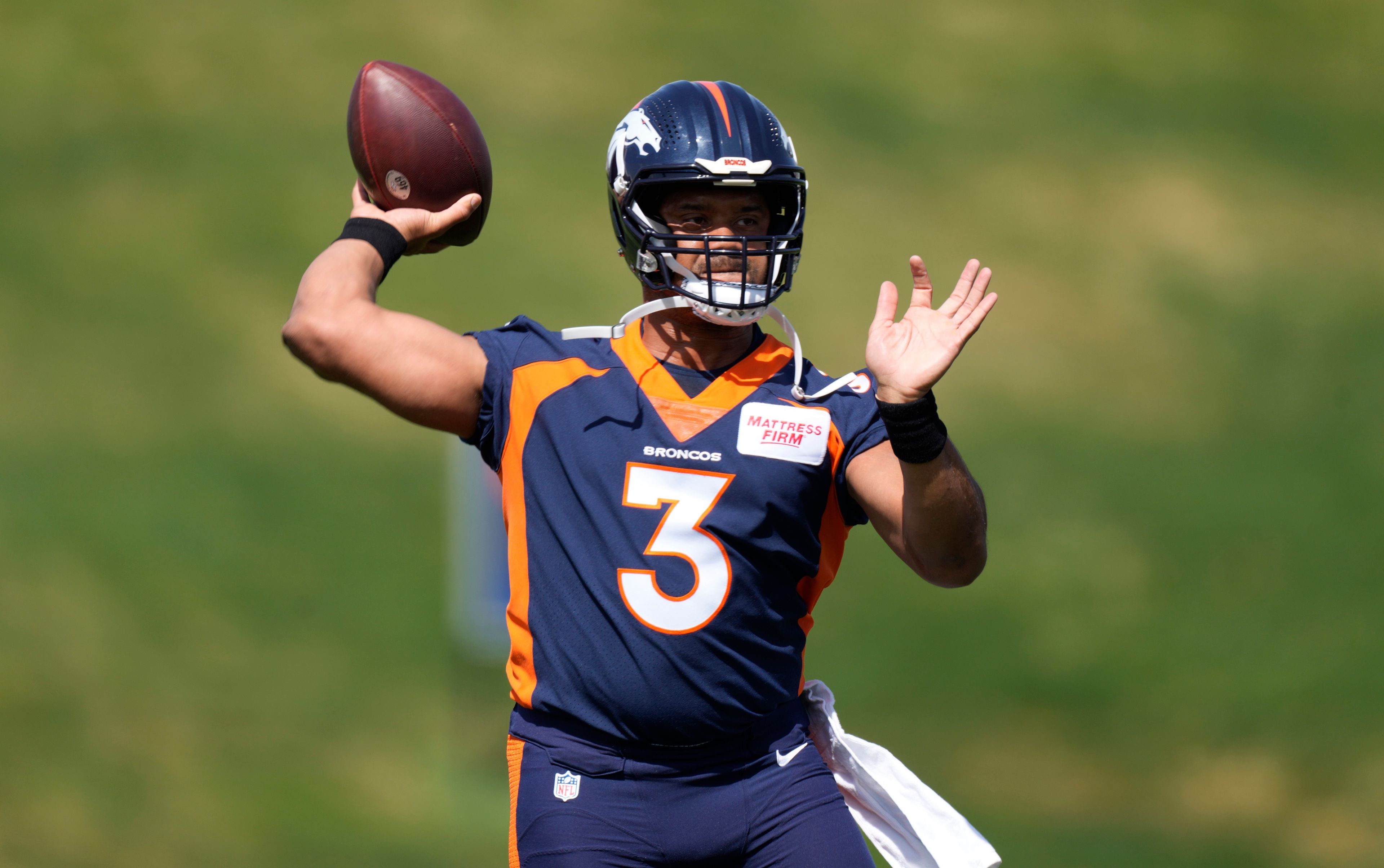 Associated Press Broncos quarterback Russell Wilson takes part in drills April 27 at the NFL football team’s voluntary minicamp at the team’s headquarters in Englewood, Colo. Wilson, the former Seattle signal-caller, will face his former team in Seattle during the regular season’s opening week.