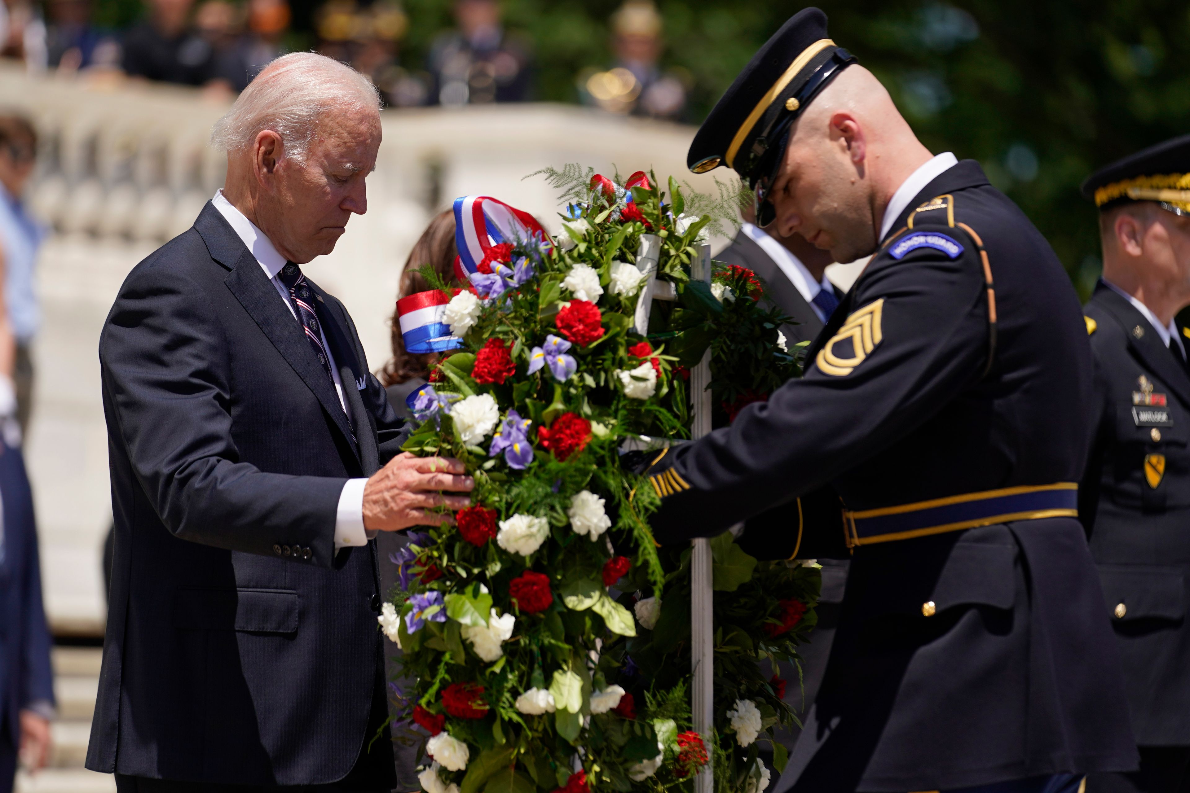 Andrew Harnik/Associated Press President Joe Biden lays a wreath at The Tomb of the Unknown Soldier at Arlington National Cemetery on Memorial Day on Monday in Arlington, Va.