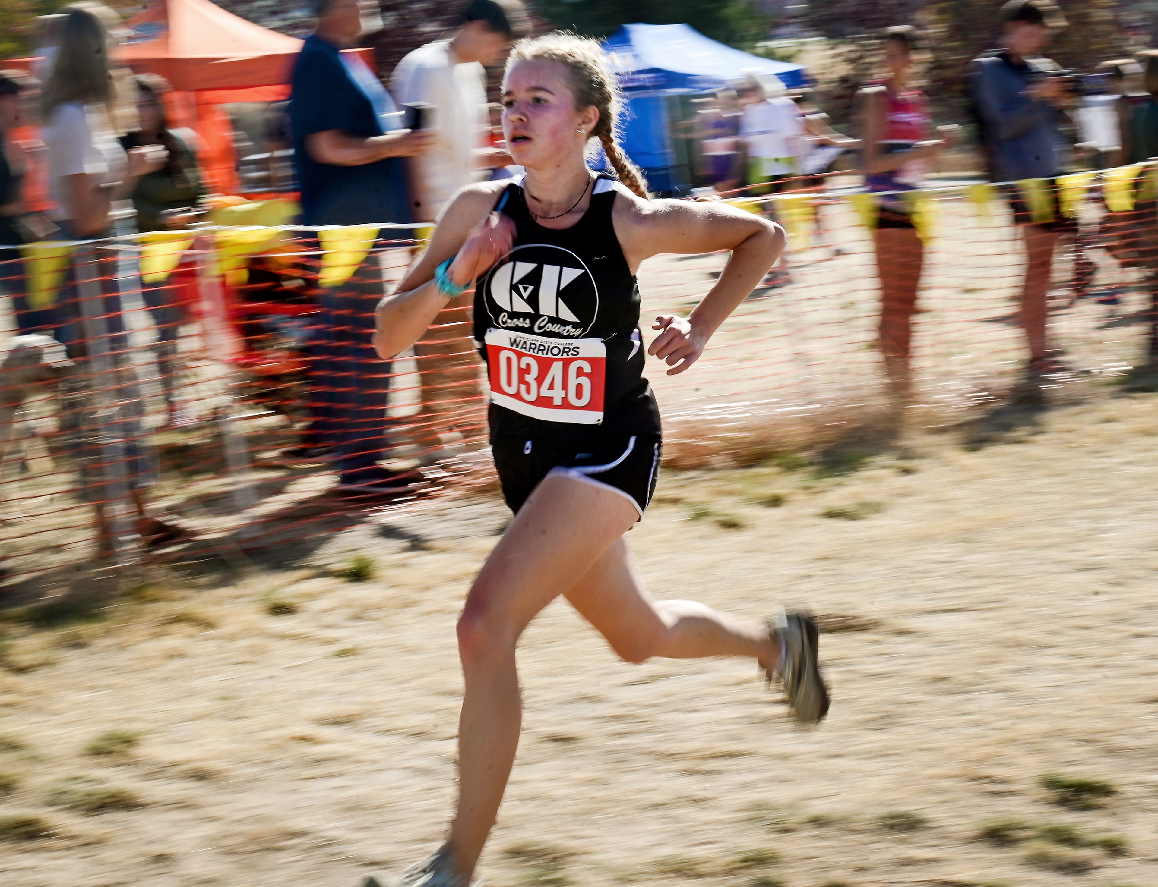 Clearwater Valley-Kamiah's Evelyn Ward finish in the Inland Empire Championships varsity girls 5K is captured with a slow shutter Saturday along the LCSC XC Course in Lewiston.,