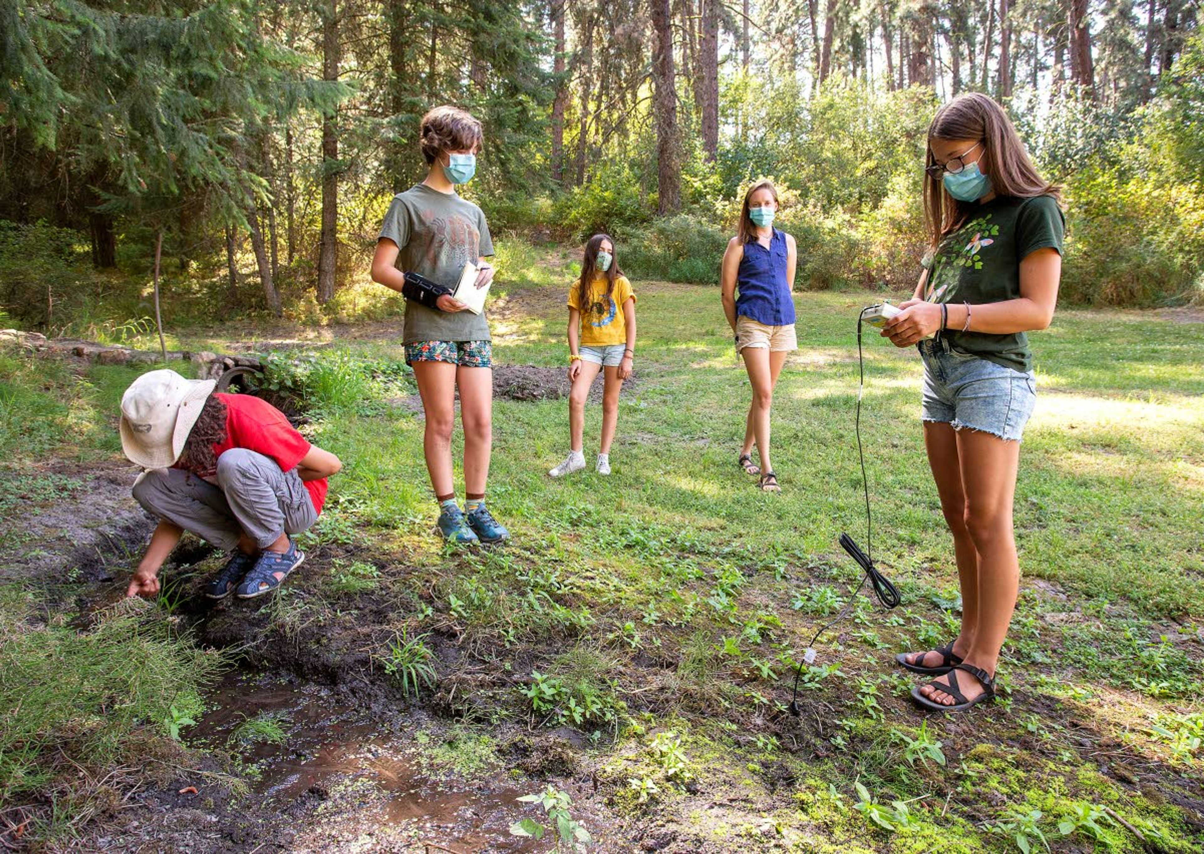 Cora Crawford, right, measures the salinity and temperature of the soil Tuesday during a Soils STREAM Team class for girls at the Paradise Ridge Retreat on Tuesday south of Moscow. The Palouse-Clearwater Environmental Institute is now teaching classes at the retreat.