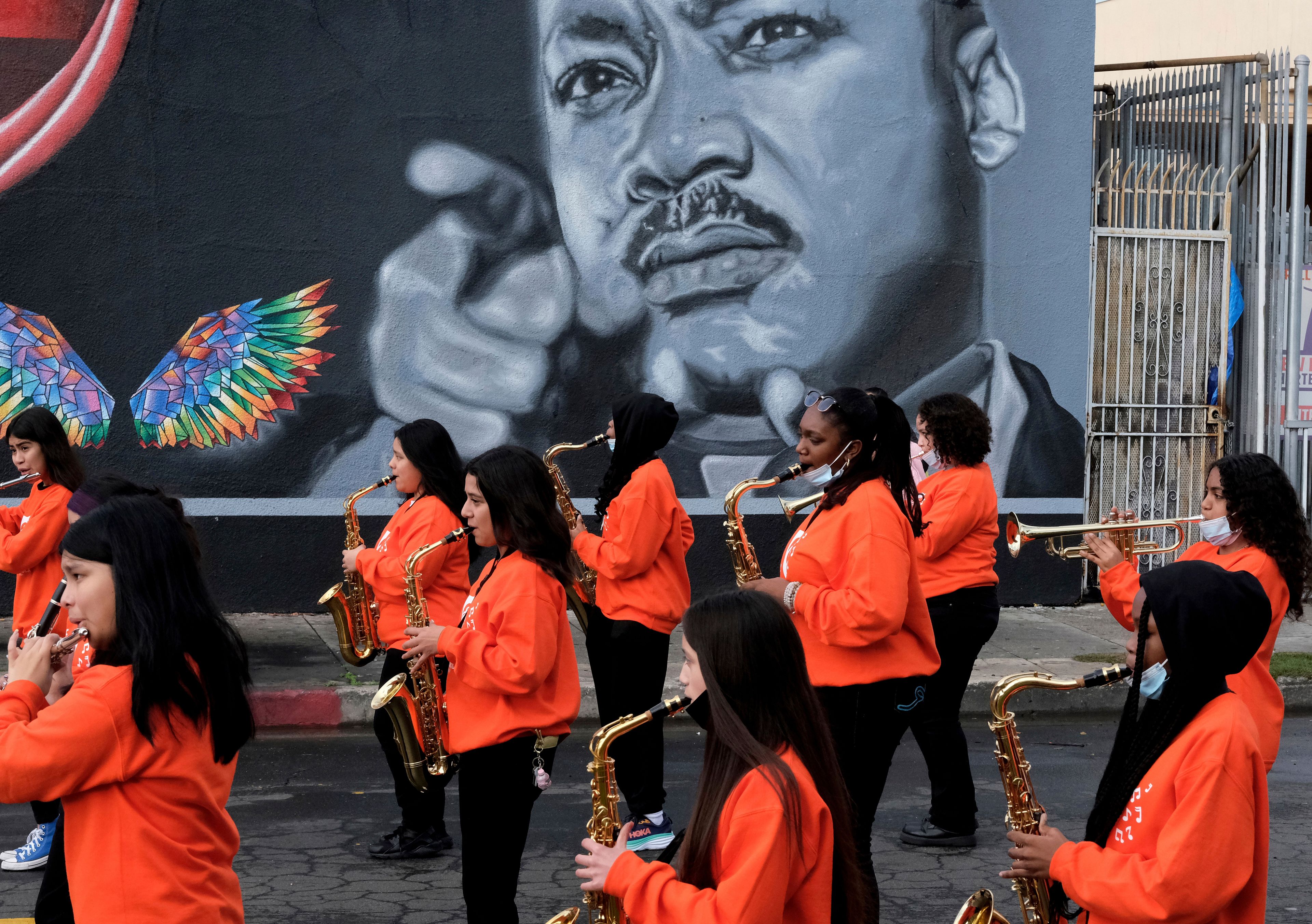 Music students from the Kipp Scholar Academy prepare to participate in the Kingdom Day Parade in Los Angeles, Monday, Jan. 16, 2023. After a two-year hiatus because of the COVID-19 pandemic, the parade, America's largest Martin Luther King Day celebration returned. (AP Photo/Richard Vogel)