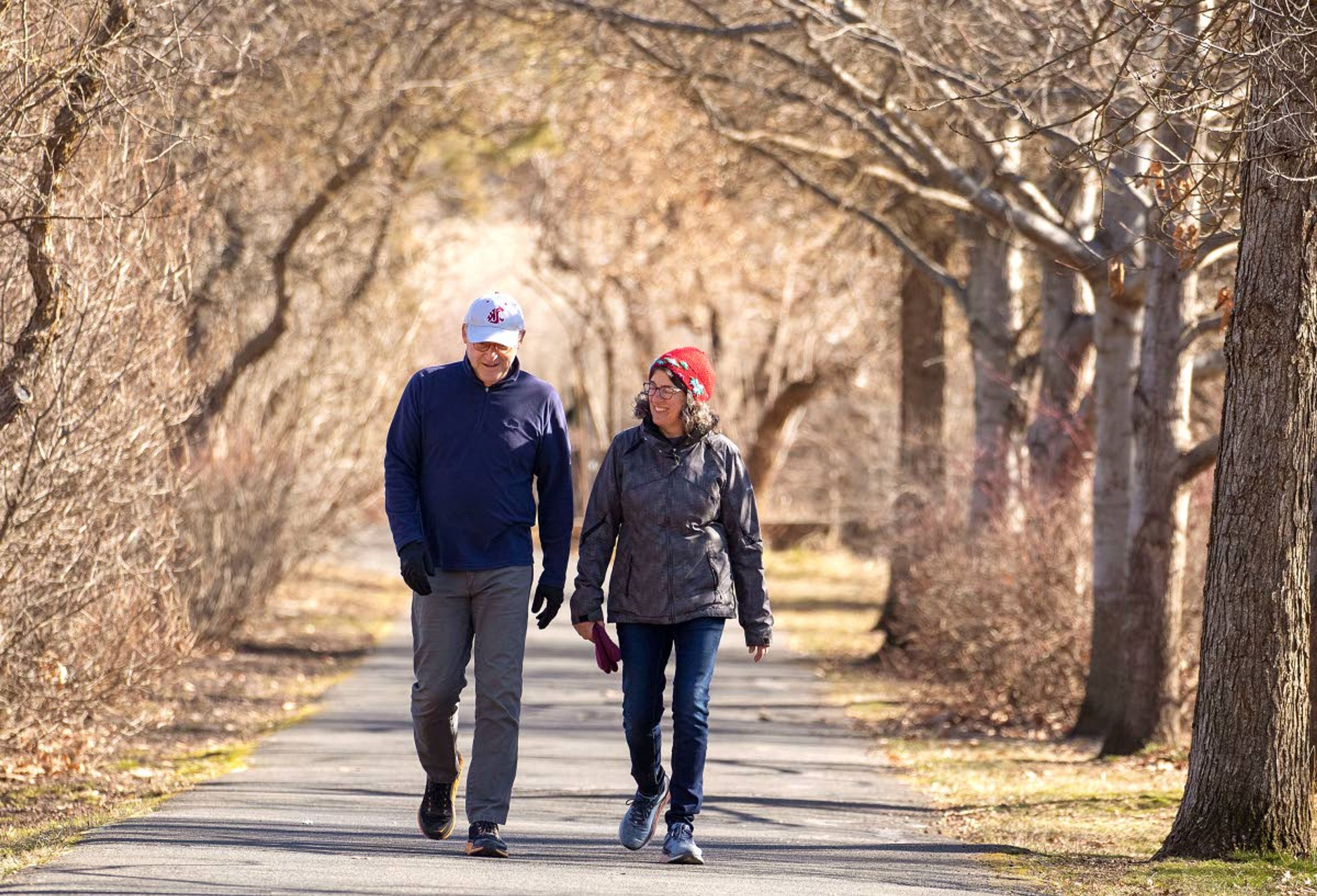 Don and Lisa Bender of Moscow enjoy the sunny weather while walking on a recreation path Saturday outside Good Samaritan Village in Moscow. Today’s forecast calls for some snow showers and a high of 38 degrees. For more, turn to Page 6A.