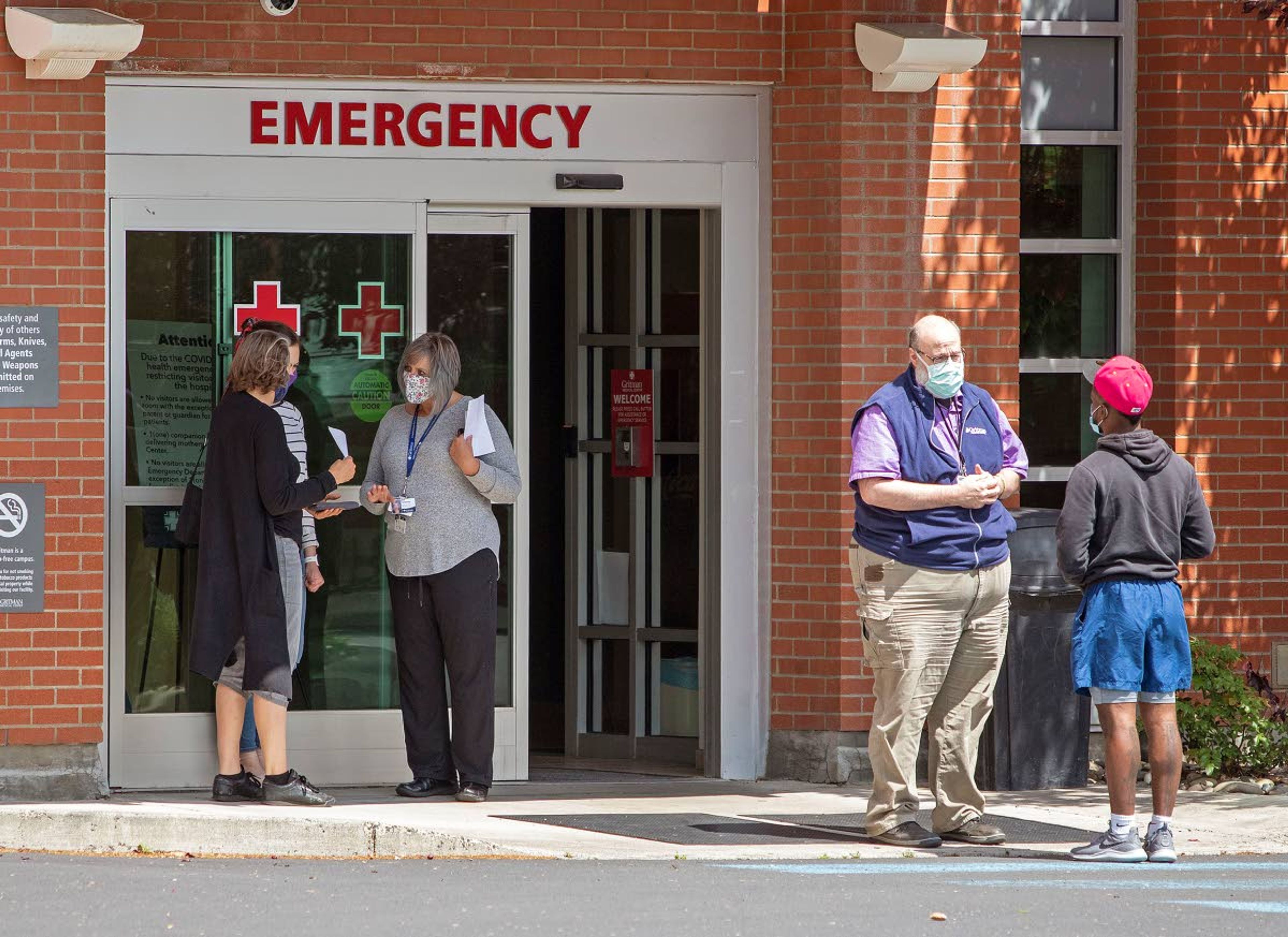 Employees screen visitors for COVID-19 before they enter the building on Tuesday at Gritman Medical Center in Moscow.