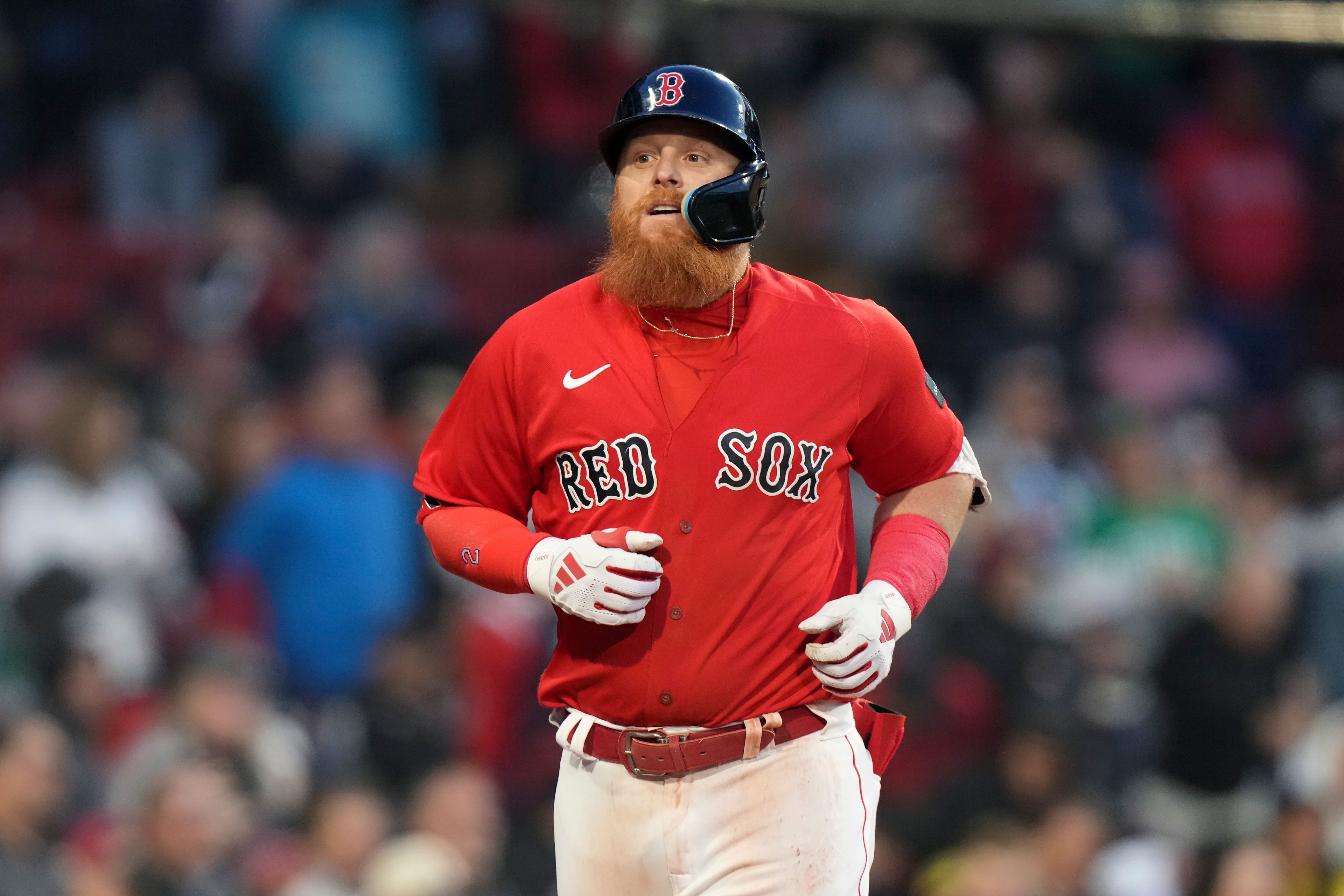 Boston Red Sox's Justin Turner returns to the dugout his two-run home run against the Seattle Mariners during the second inning of a baseball game Wednesday, May 17, 2023, in Boston. (AP Photo/Steven Senne)