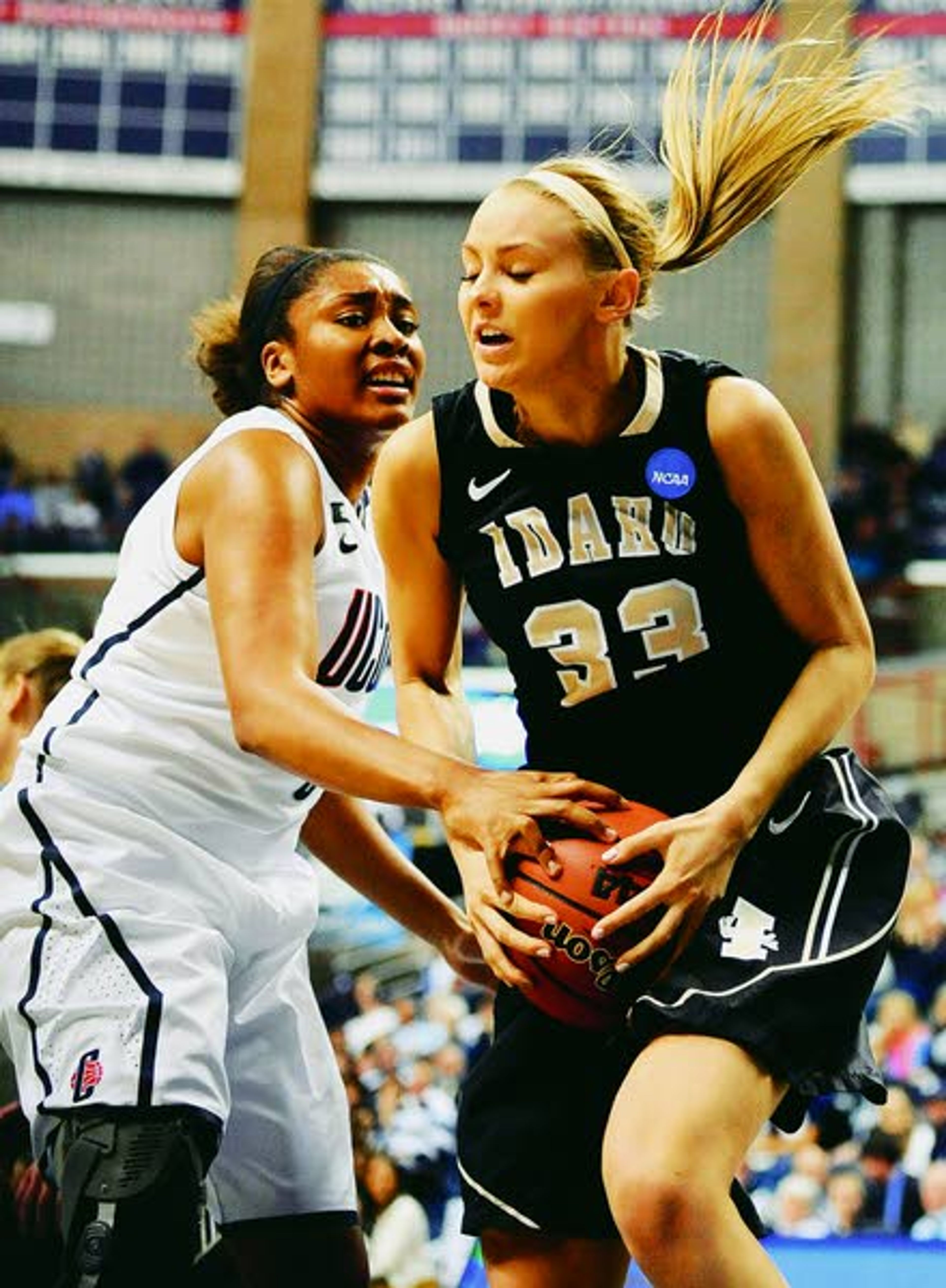 Idaho’s Alyssa Charlston, right, hangs onto a rebound against Connecticut’s Morgan Tuck in the first half of a first-round game in the women’s NCAA Tournament on March 23, 2013, in Storrs, Conn.Associated Press., Saturday, March 23, 2013. (AP Photo/Jessica Hill)