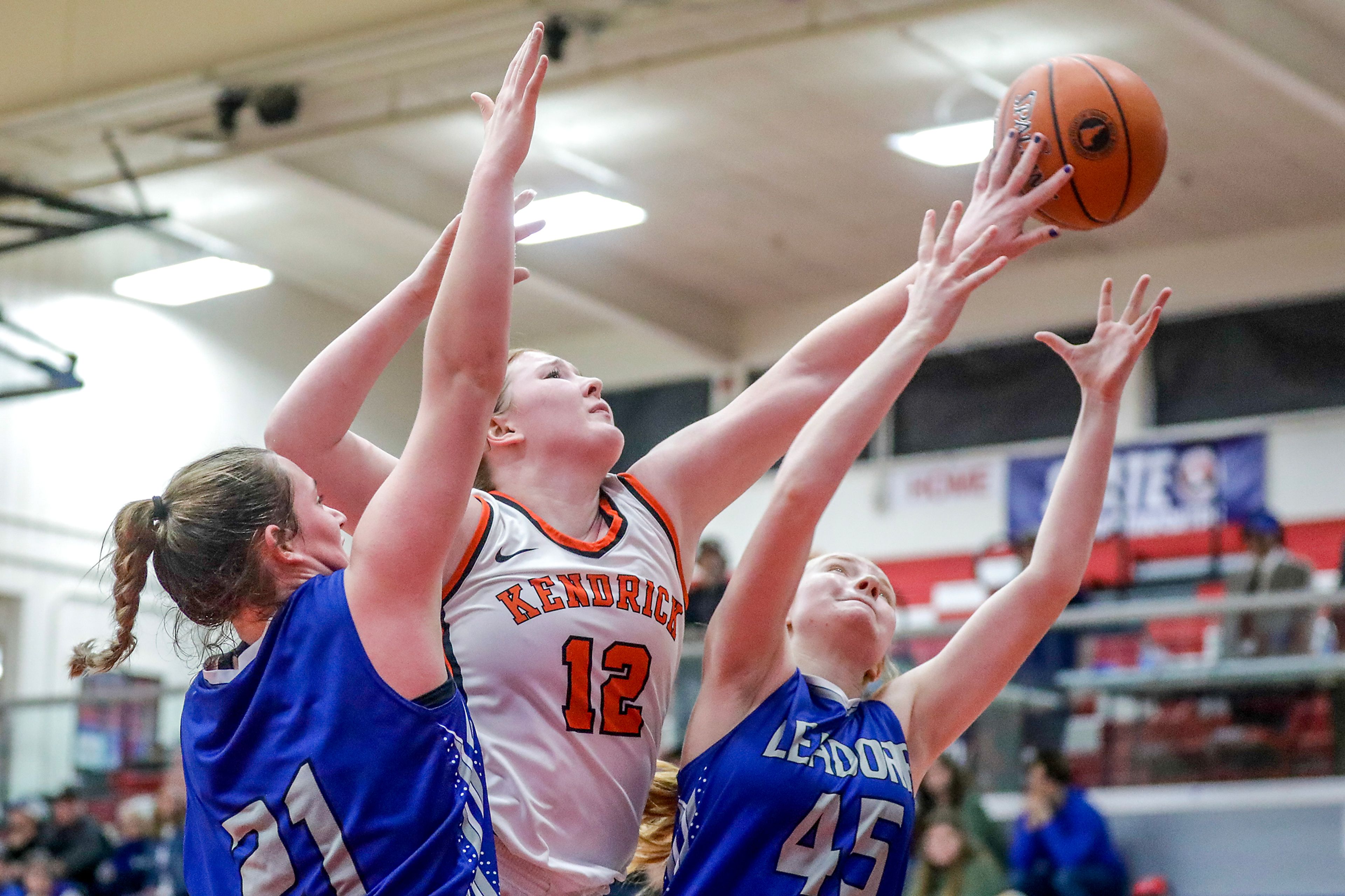 Kendrick post Natalie Kimbley knocks the rebound away from Leadore's Lexi Bird and Leadore's Azelynn Jones during a quarterfinal game in the girls 1A DII state tournament Thursday at Nampa High School in Nampa.