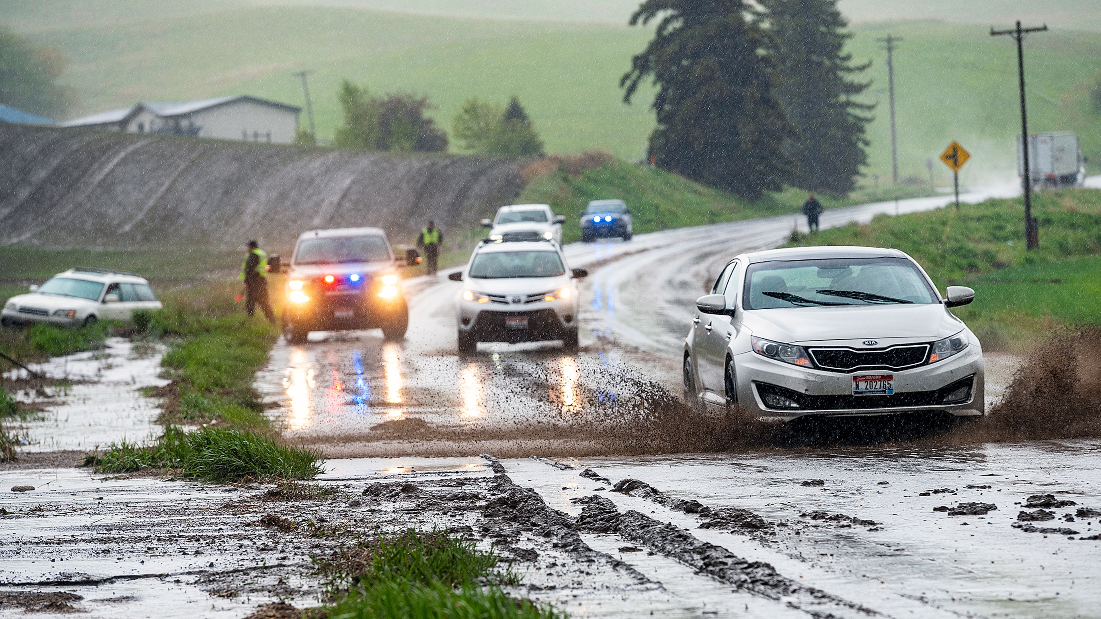 Cars drive slowly through a slog of mud that covered U.S. Highway 95 south of Moscow on Sunday evening. Heavy rains from a thunderstorm that swept through the area from the south brought high winds, lightning and lots of rain.