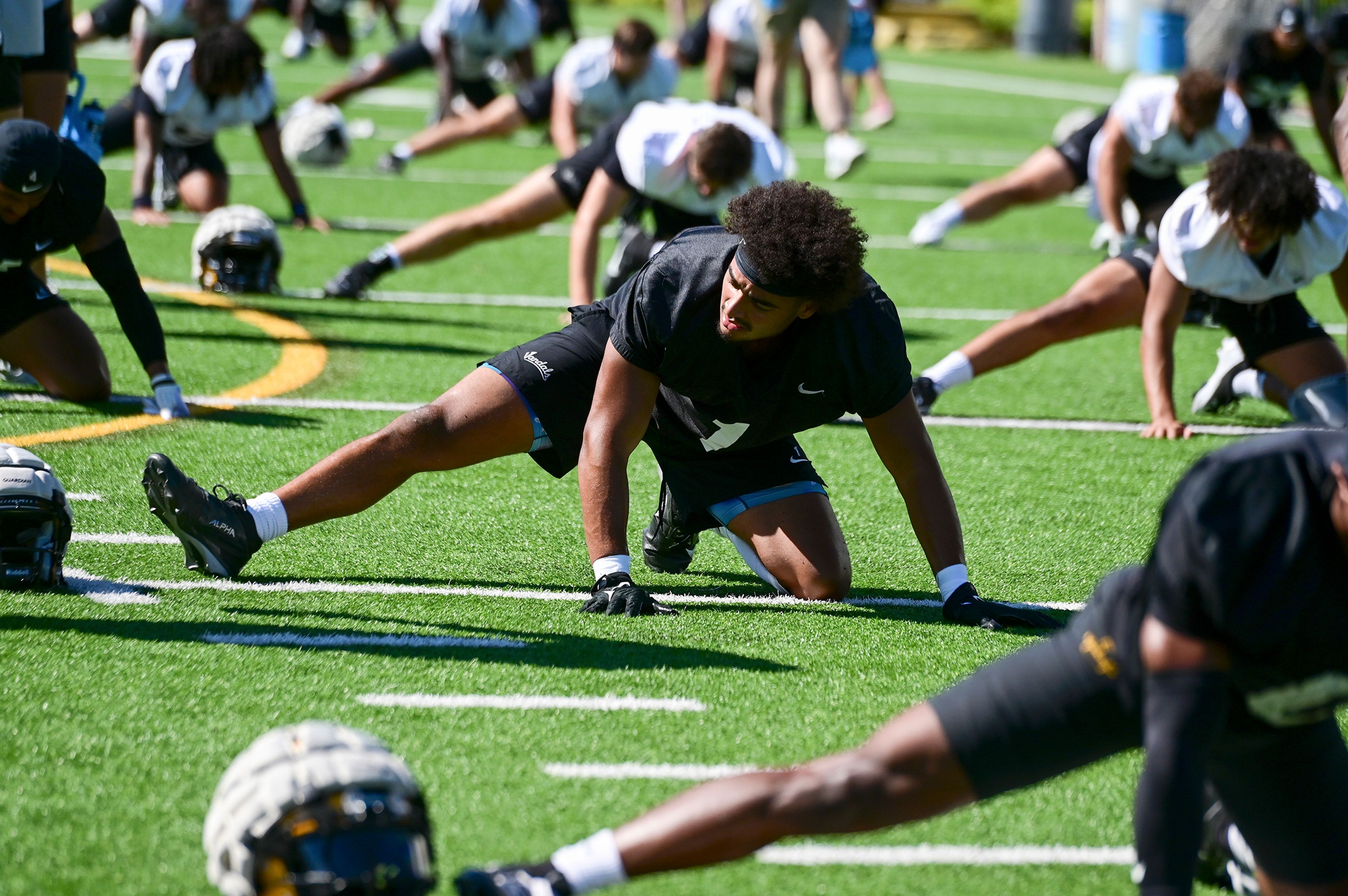 Idaho defensive lineman Keyshawn James-Newby takes part in stretches during a practice in fall camp in Moscow.