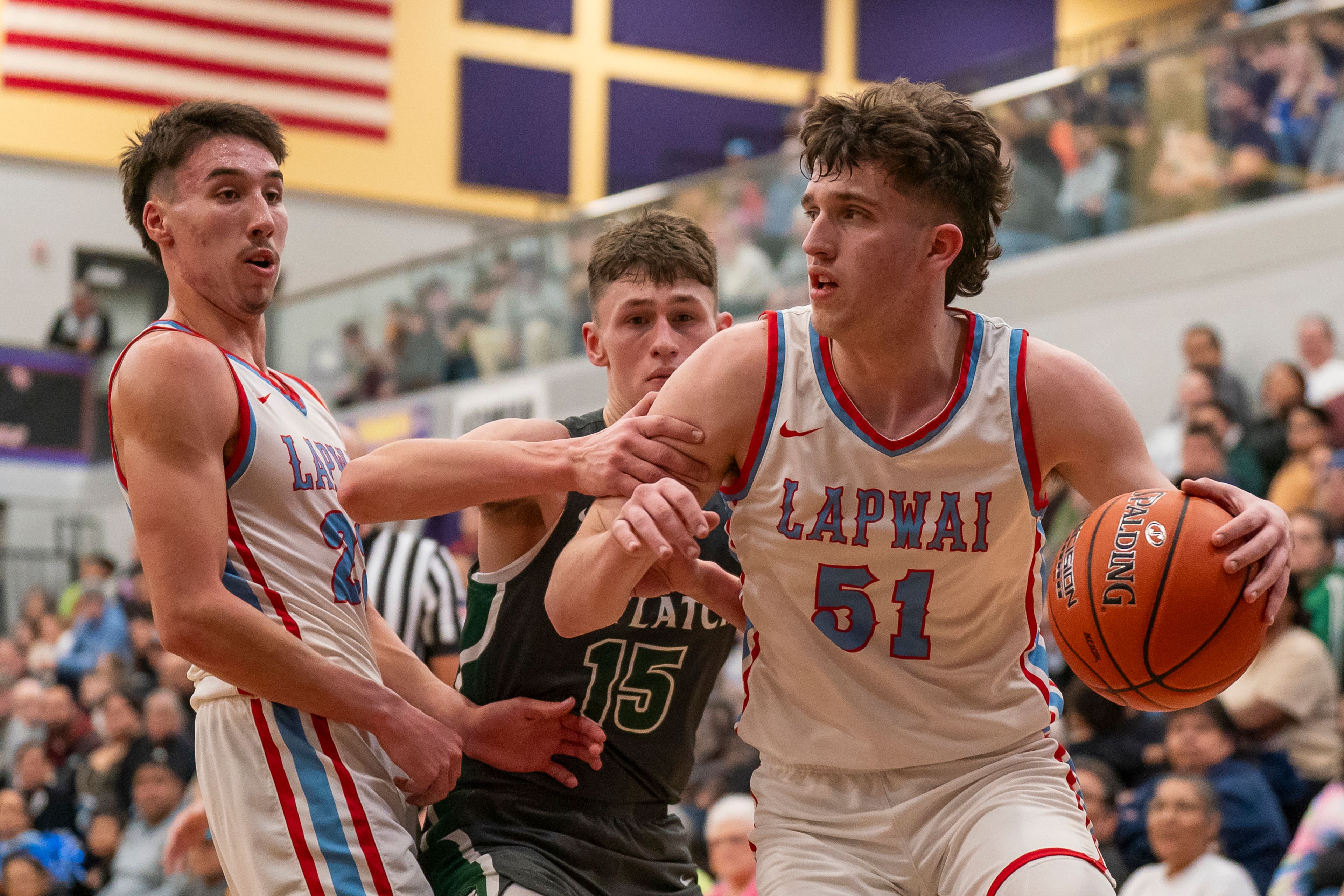 Lapwai’s Kase Wynott, right, drives to the basket during an Idaho Class 1A Division 1 district championship game against Potlatch on Feb. 21 at Lewiston High School.