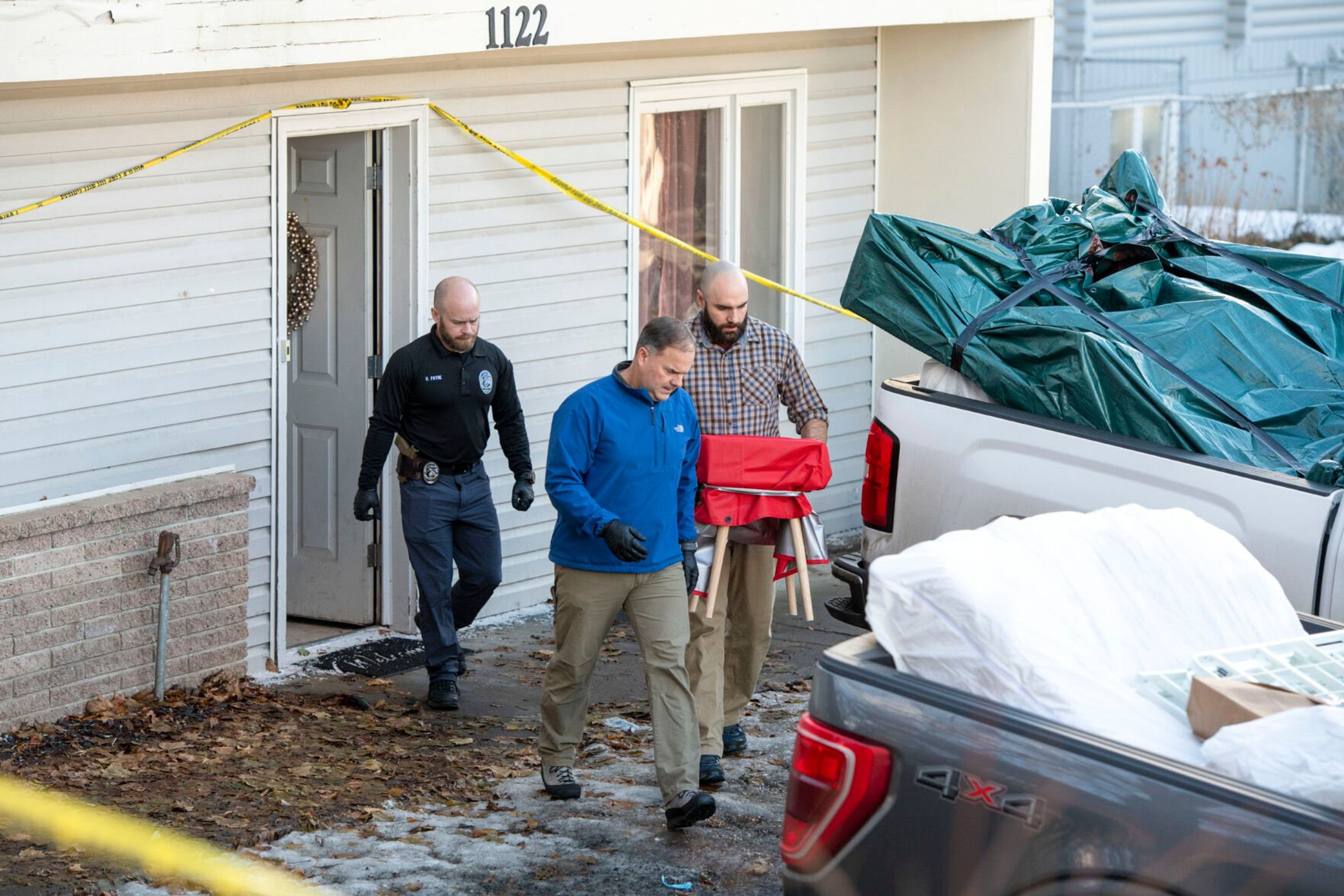 Law enforcement removes items Friday from the residence where four University of Idaho students were murdered on Nov. 13 in Moscow.