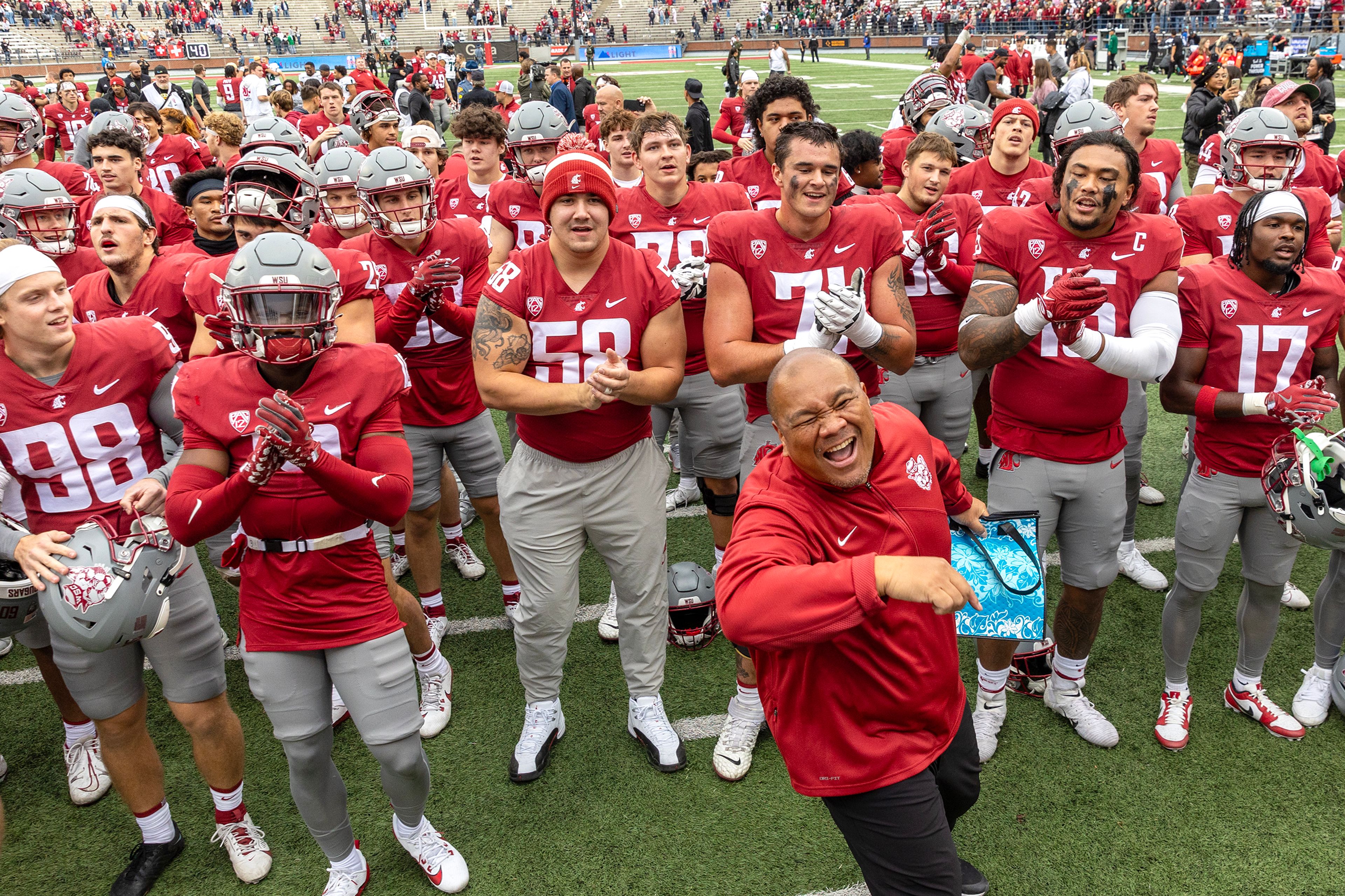 Washington State celebrates their victory over Hawaii in a college football game on Saturday at Gesa Field in Pullman.,