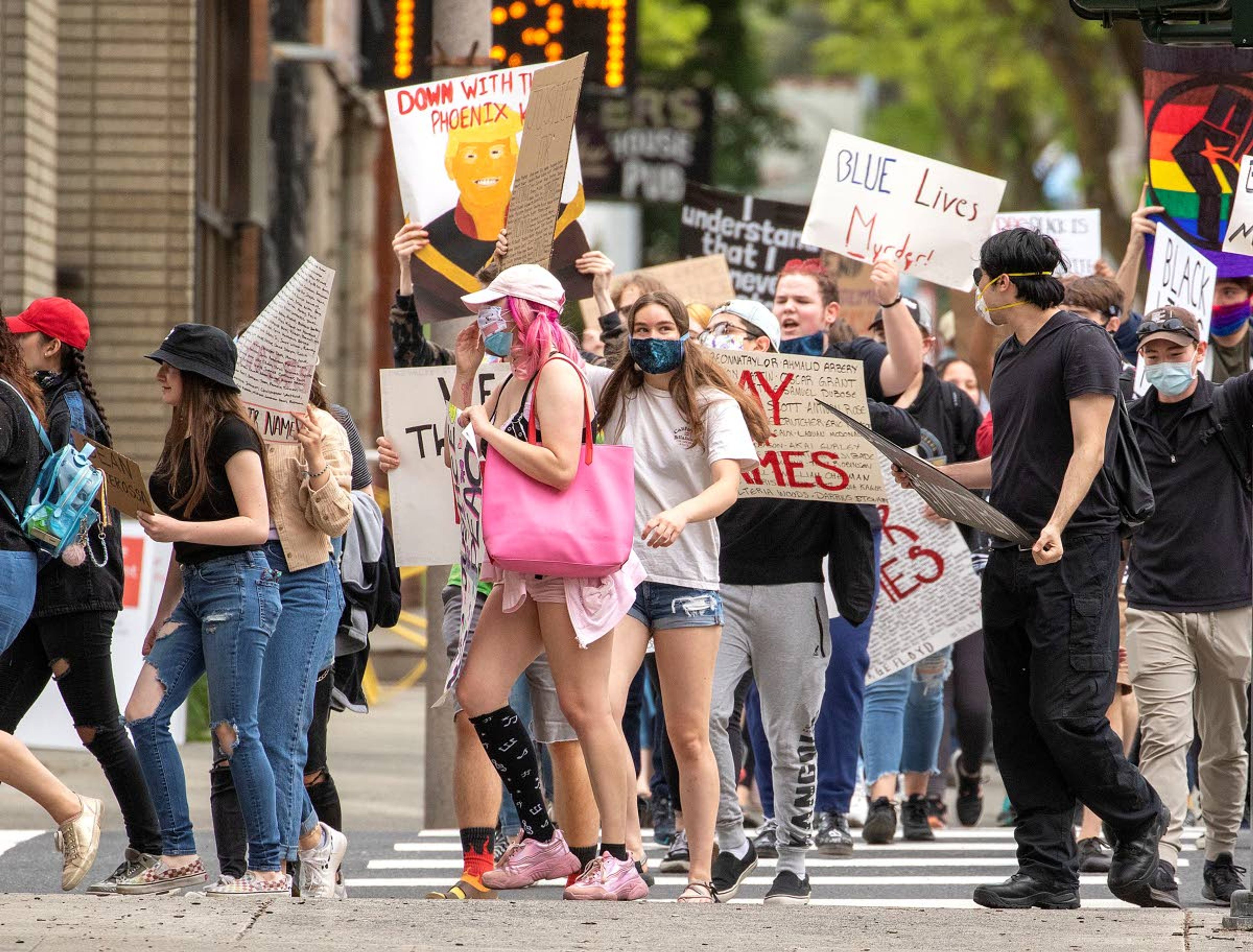 Protesters march through downtown during a demonstration over the death of George Floyd on Friday in Moscow. More than 50 people participated in the demonstration.