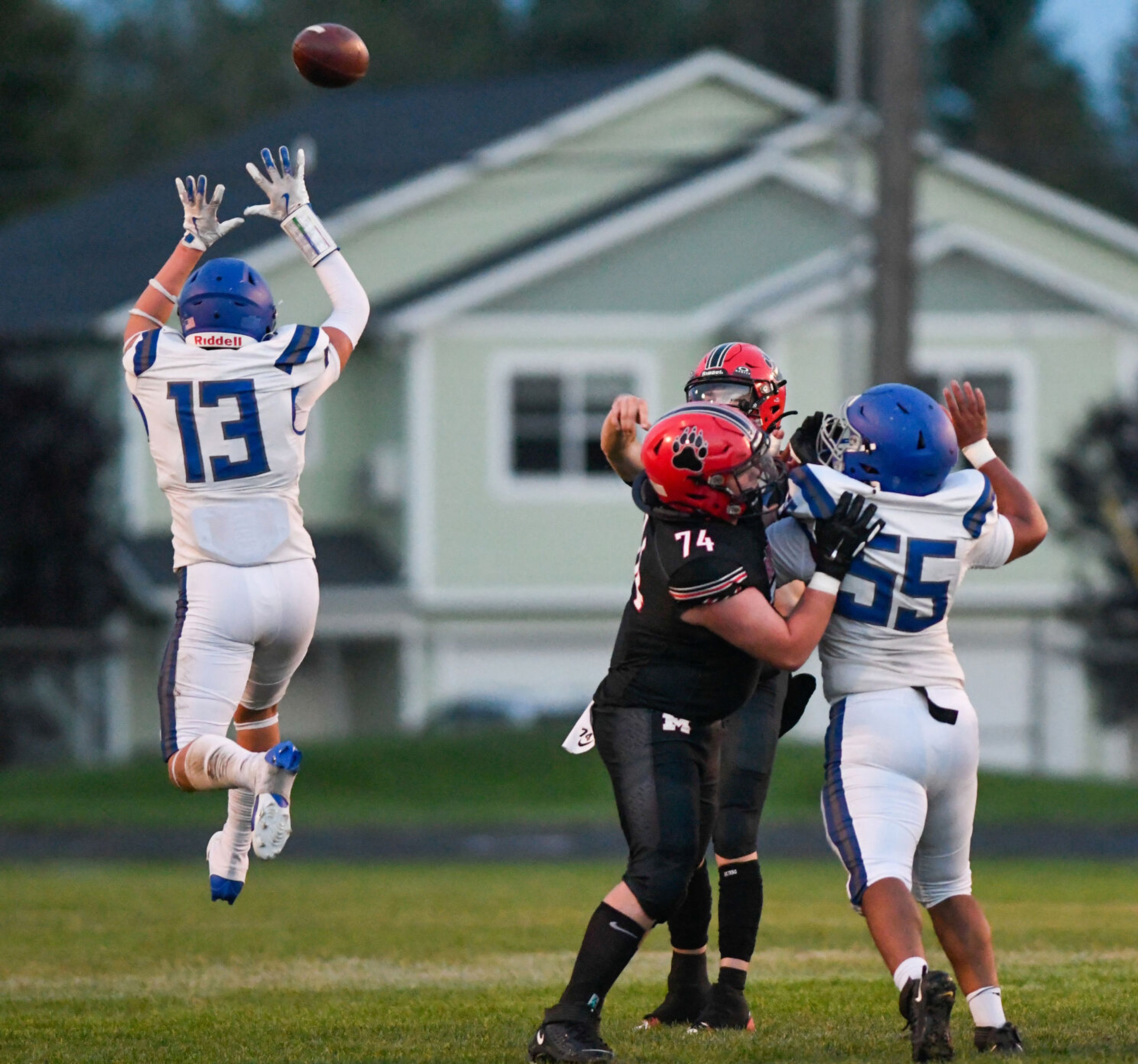 Pullman linebacker Kolten Kendall jumps in an attempt to block a pass by Moscow quarterback Noah Velasco Friday in Moscow.