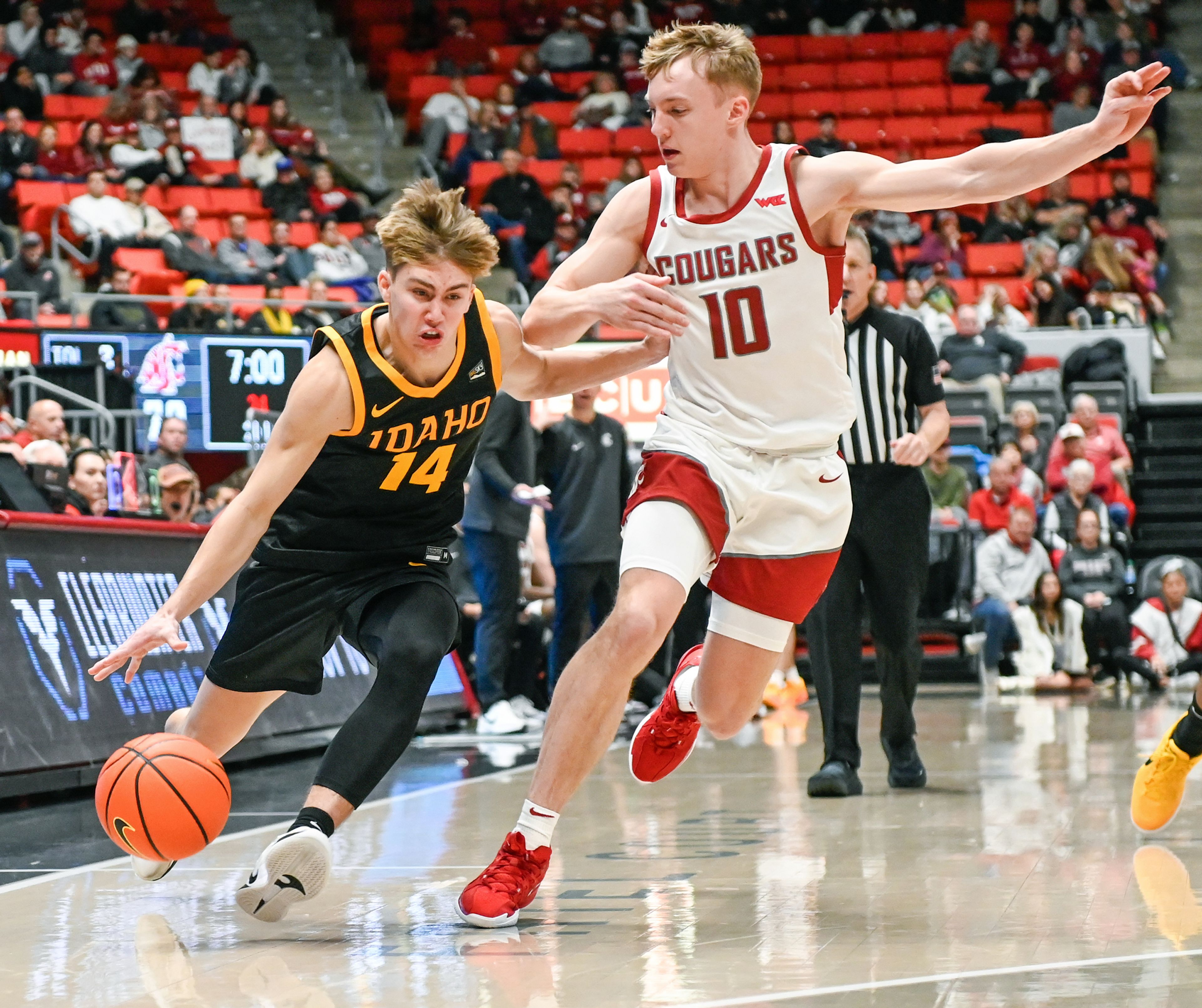 Idaho guard Kolton Mitchell moves down the court with pressure from Washington State guard Parker Gerrits during Battle of the Palouse game Monday at Beasley Coliseum in Pullman.