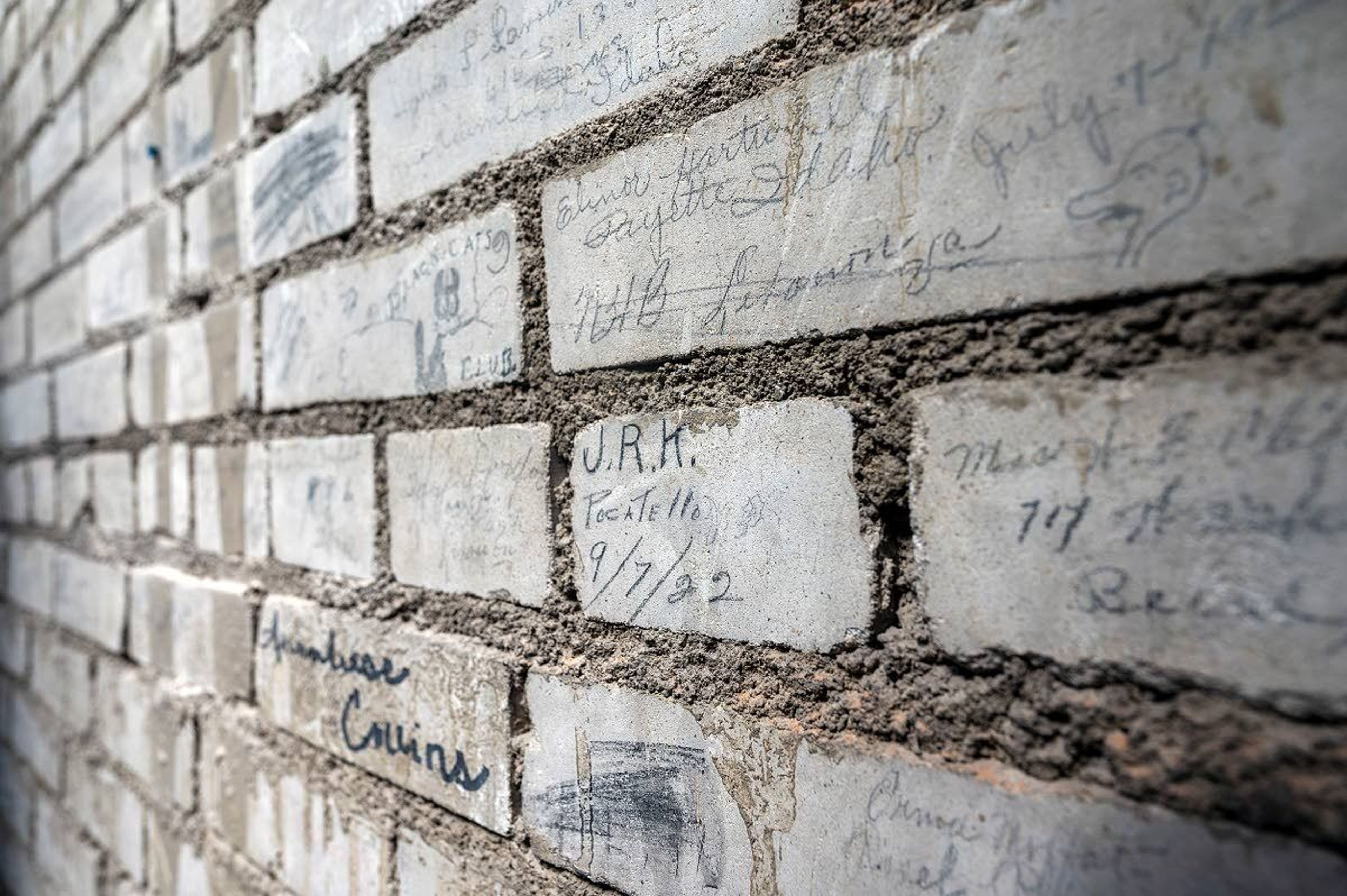 Many of the pages who work in the Idaho Senate and House write their names or initials on bricks inside the parapet level of the Idaho Capitol dome.