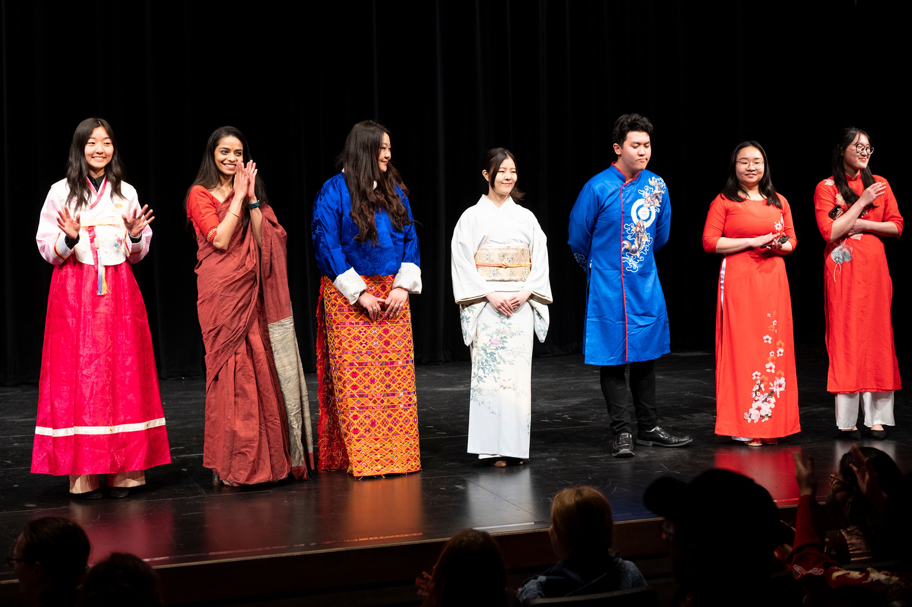 Participants showcase traditional clothing from various countries Friday at Pullman High School’s multicultural night.