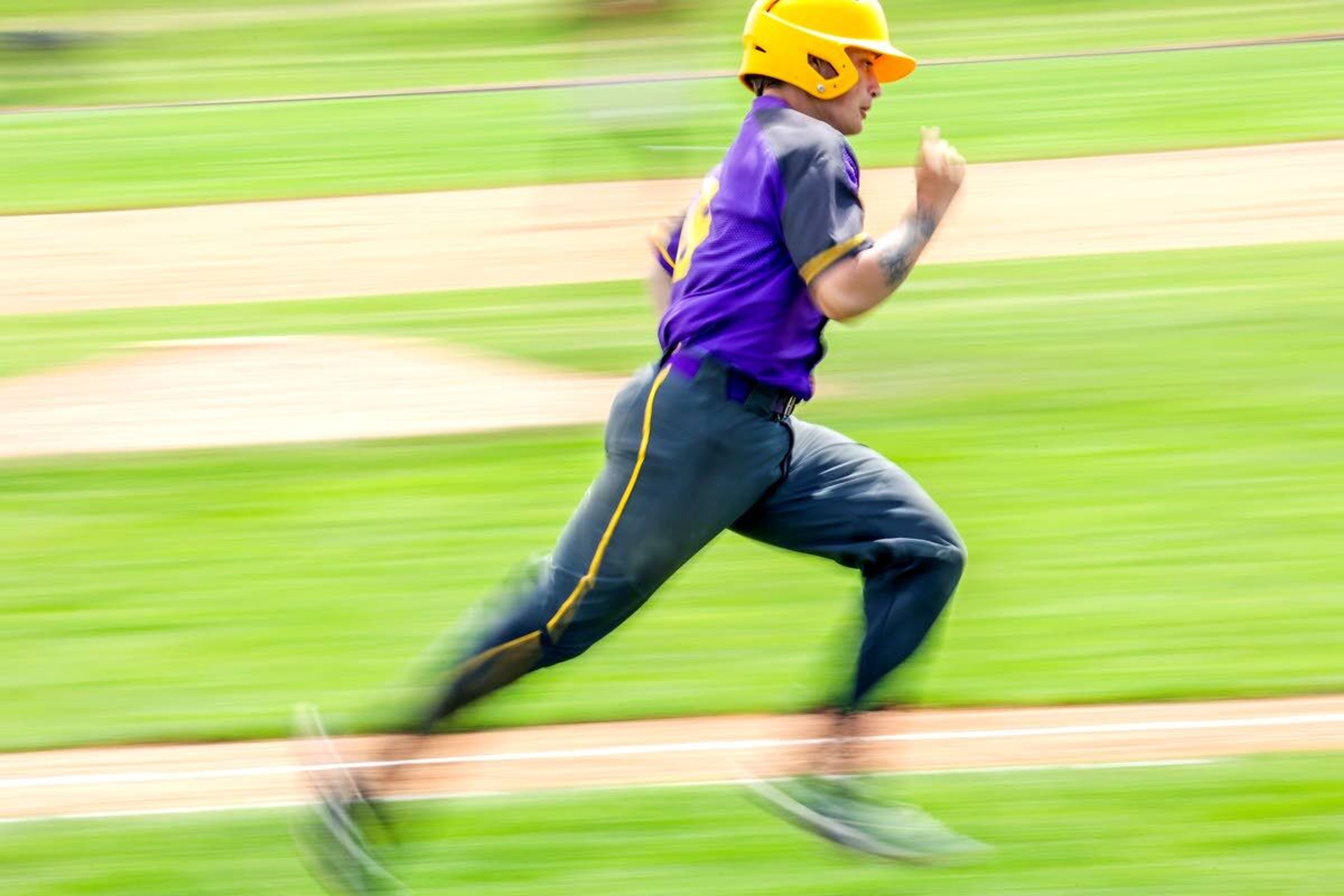 Lewiston’s Killian Fox sprints for first base after getting a hit during the first inning of an Inland Empire League game against Moscow at Church Field. Fox's double in a five-run first inning spurred the Bengals to a 6-4 win against the Bears.