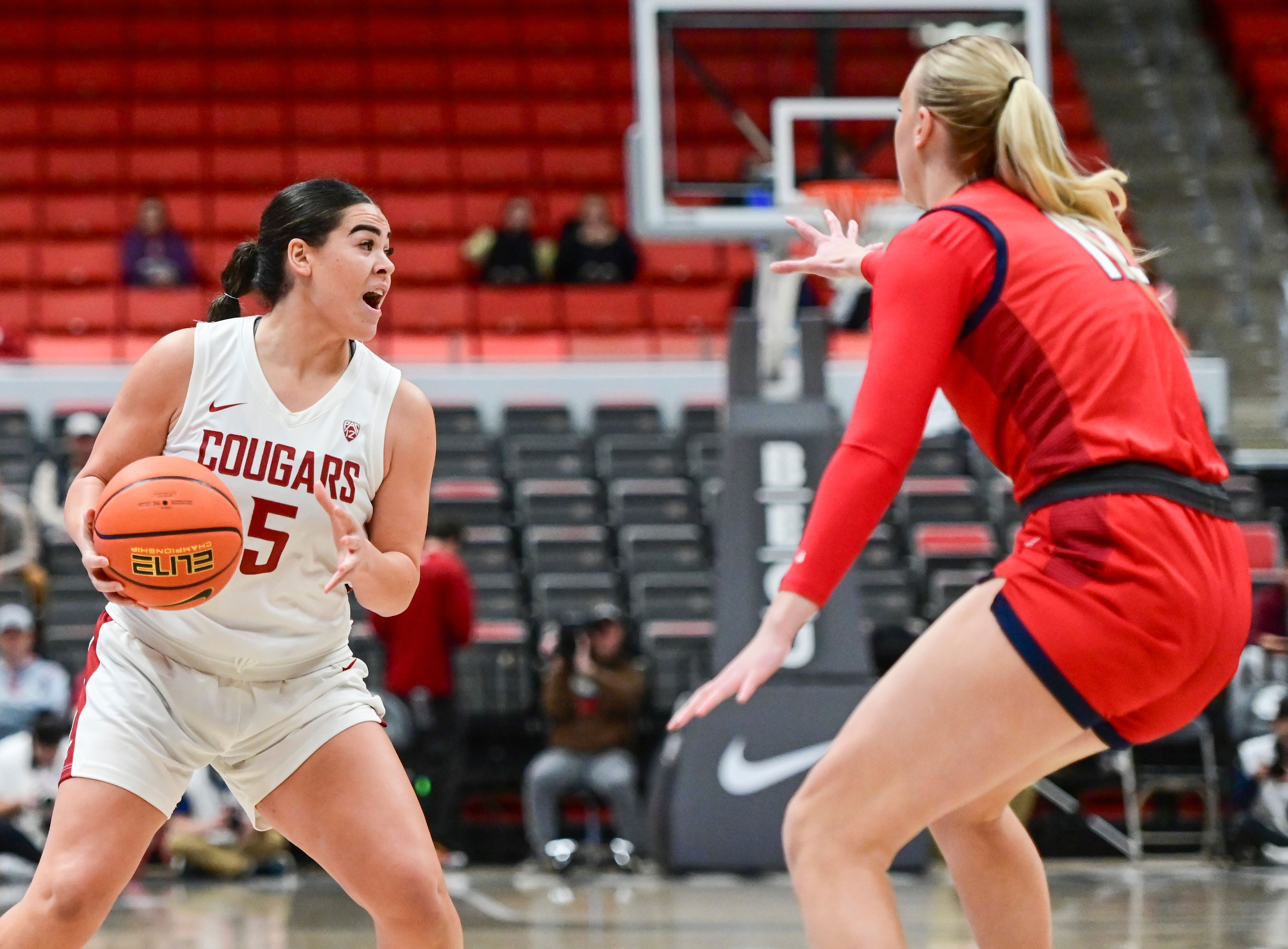 Washington State guard Charlisse Leger-Walker, left, shouts for an open player while being guarded by Gonzaga forward Eliza Hollingsworth, right, during a game Nov. 9 at Beasley Coliseum in Pullman.