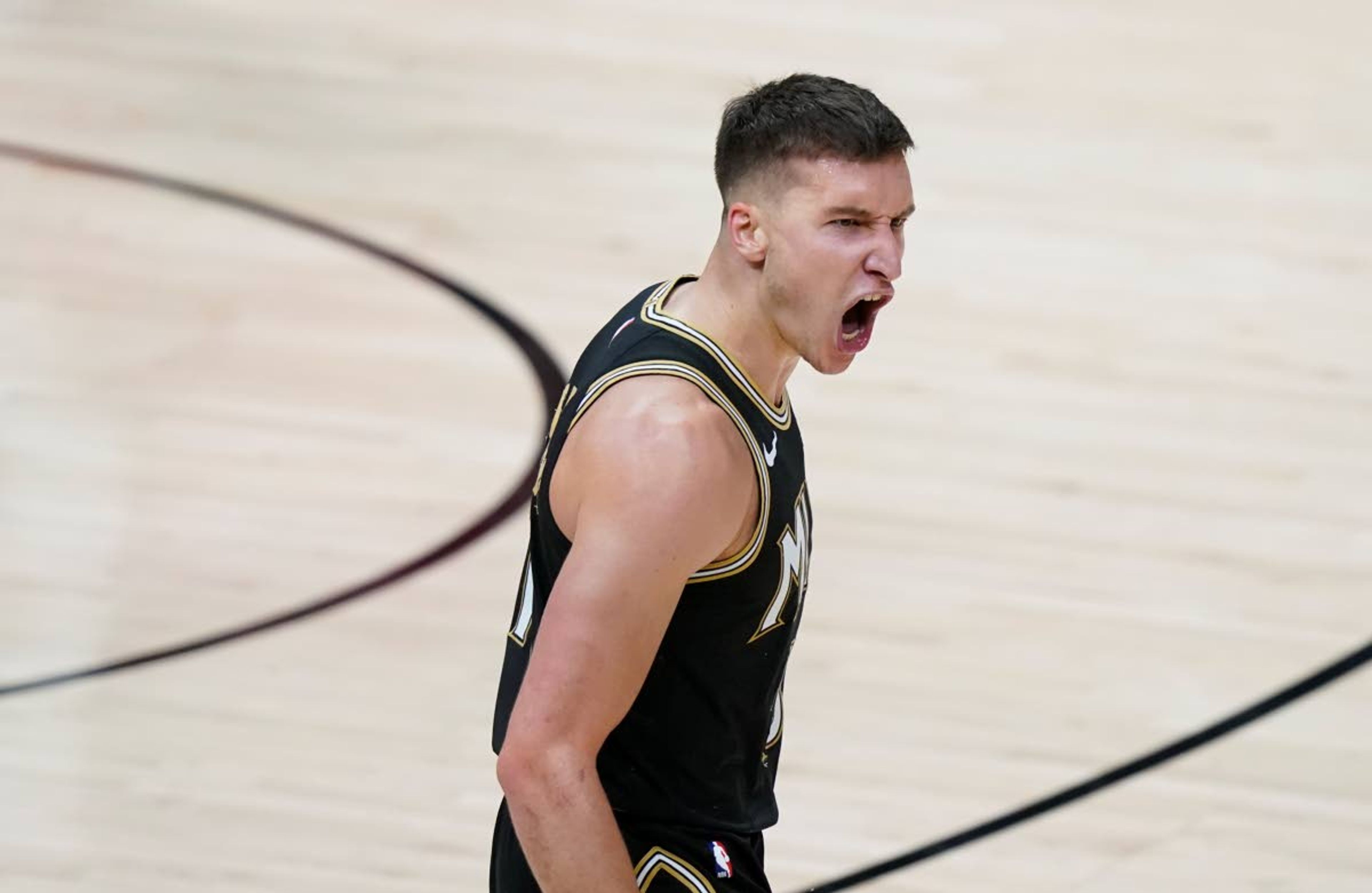 Atlanta Hawks' Bogdan Bogdanovic reacts after scoring during the second half against the Milwaukee Bucks in Game 4 of the NBA basketball Eastern Conference finals Tuesday, June 29, 2021, in Atlanta. (AP Photo/Brynn Anderson)