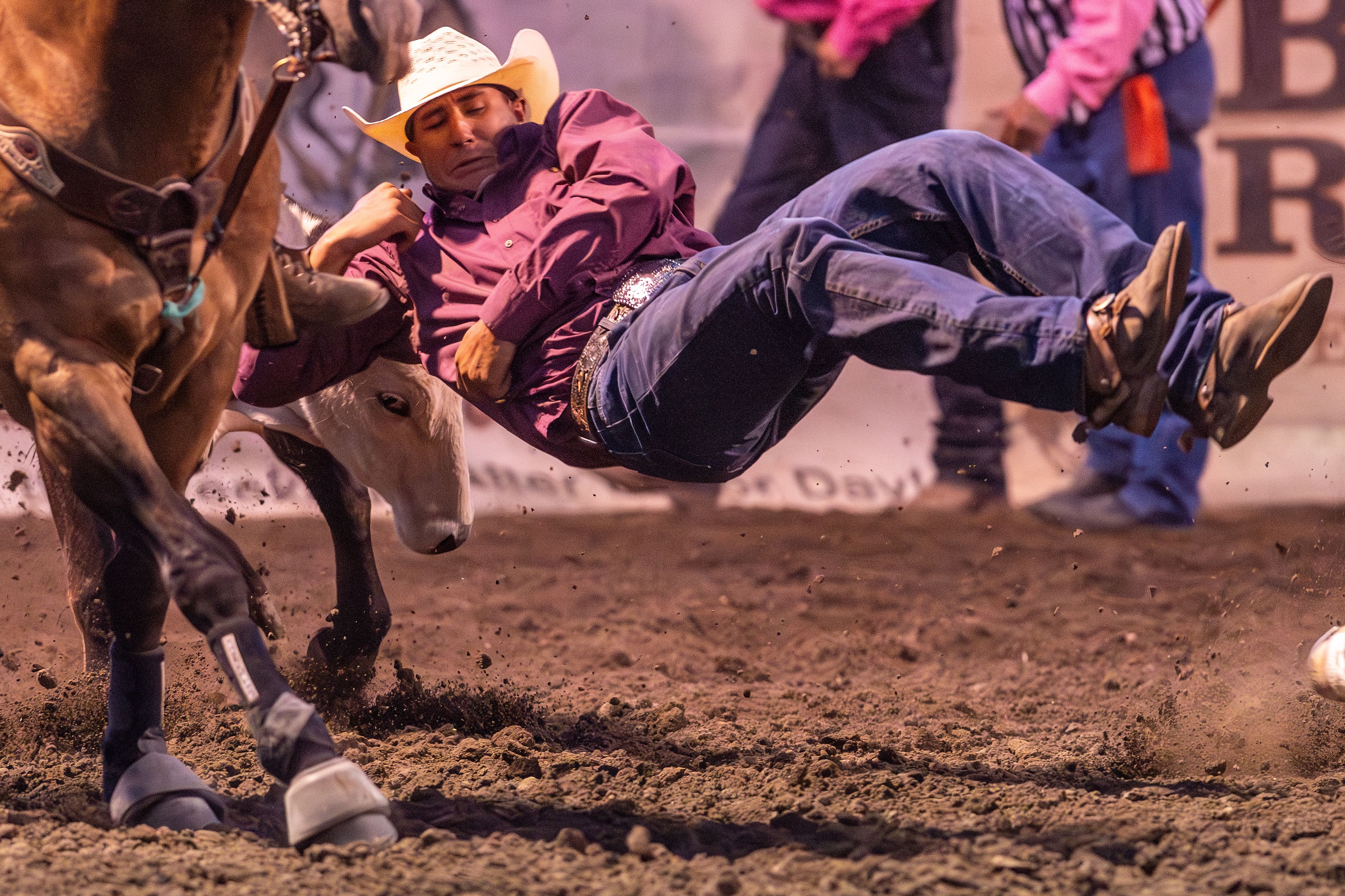 Ryan Bothum misses his steer as he leaps from his horse in the steer wrestling competition on day 3 of the Lewiston Roundup.