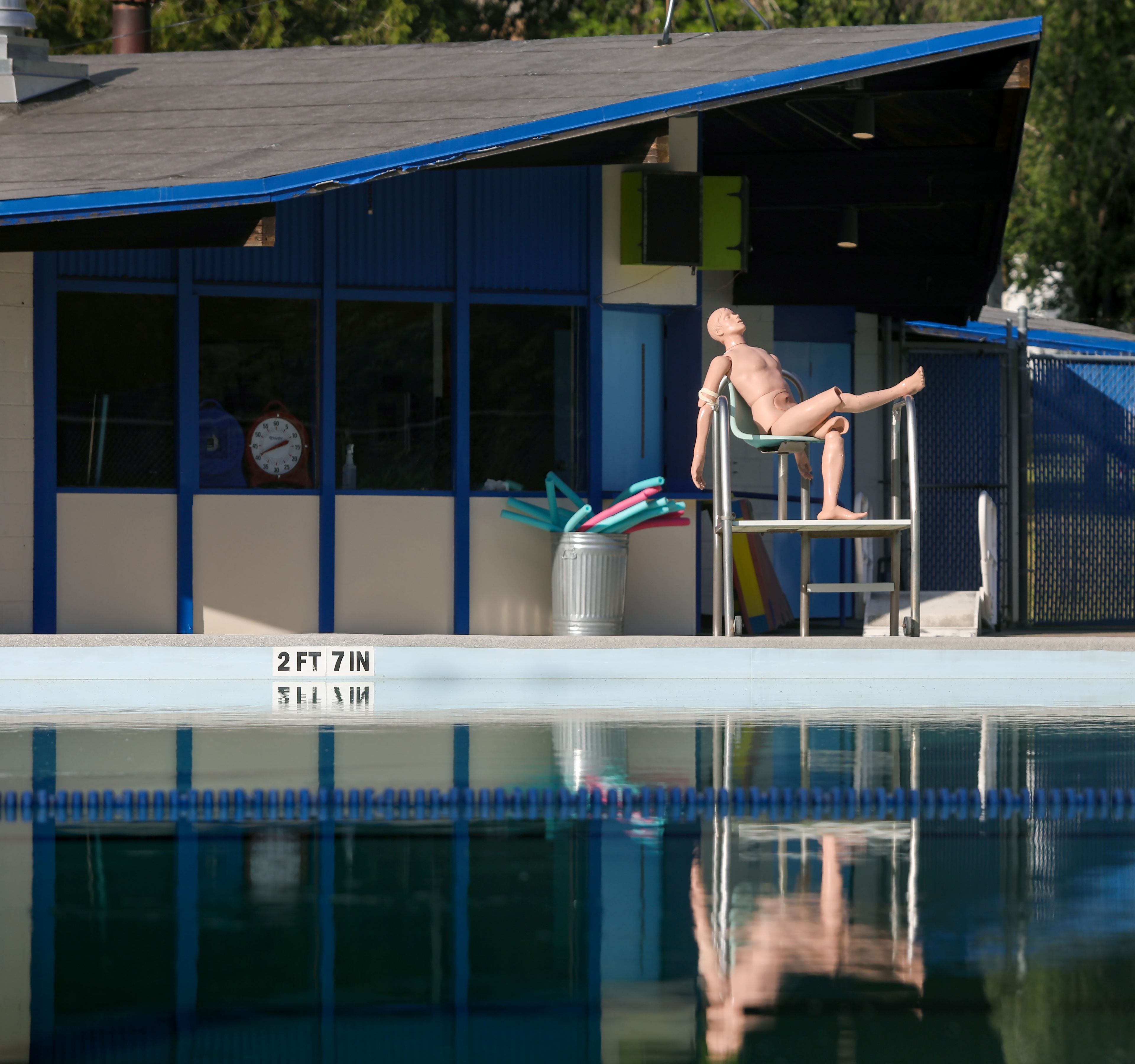 A lifeguard training manikin sits in the sun with a leg propped up on a lookout platform recently at Reaney Park Pool in Pullman. The pool opened for the summer this week and is open daily from 1-6 p.m.