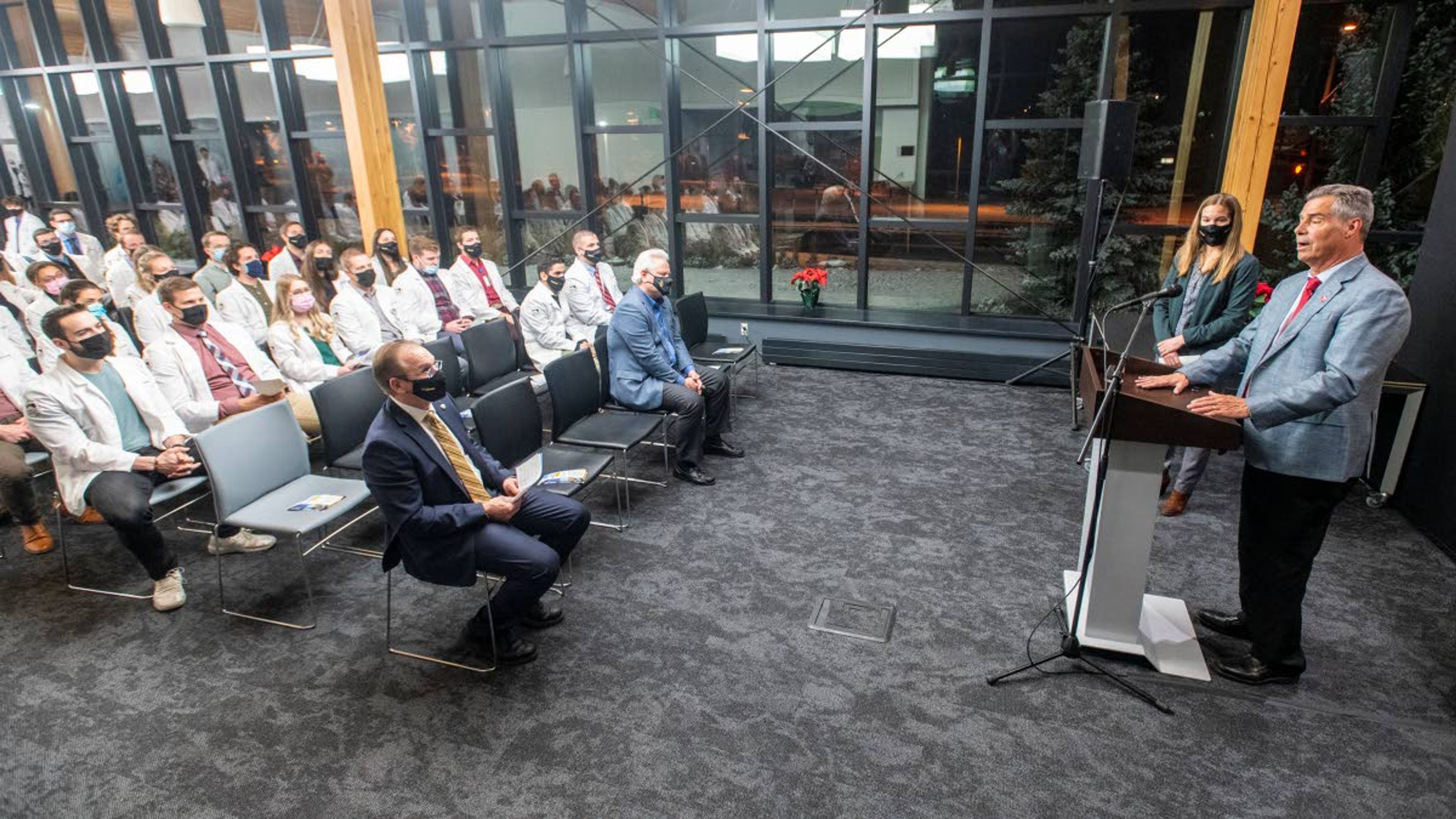 Norco’s Chairman of the Board Jim Kissler speaks to a crowd of medical students prior to a ribbon cutting in honor of the new Norco classroom at the WWAMI Medical Education Building in Moscow on Monday night.