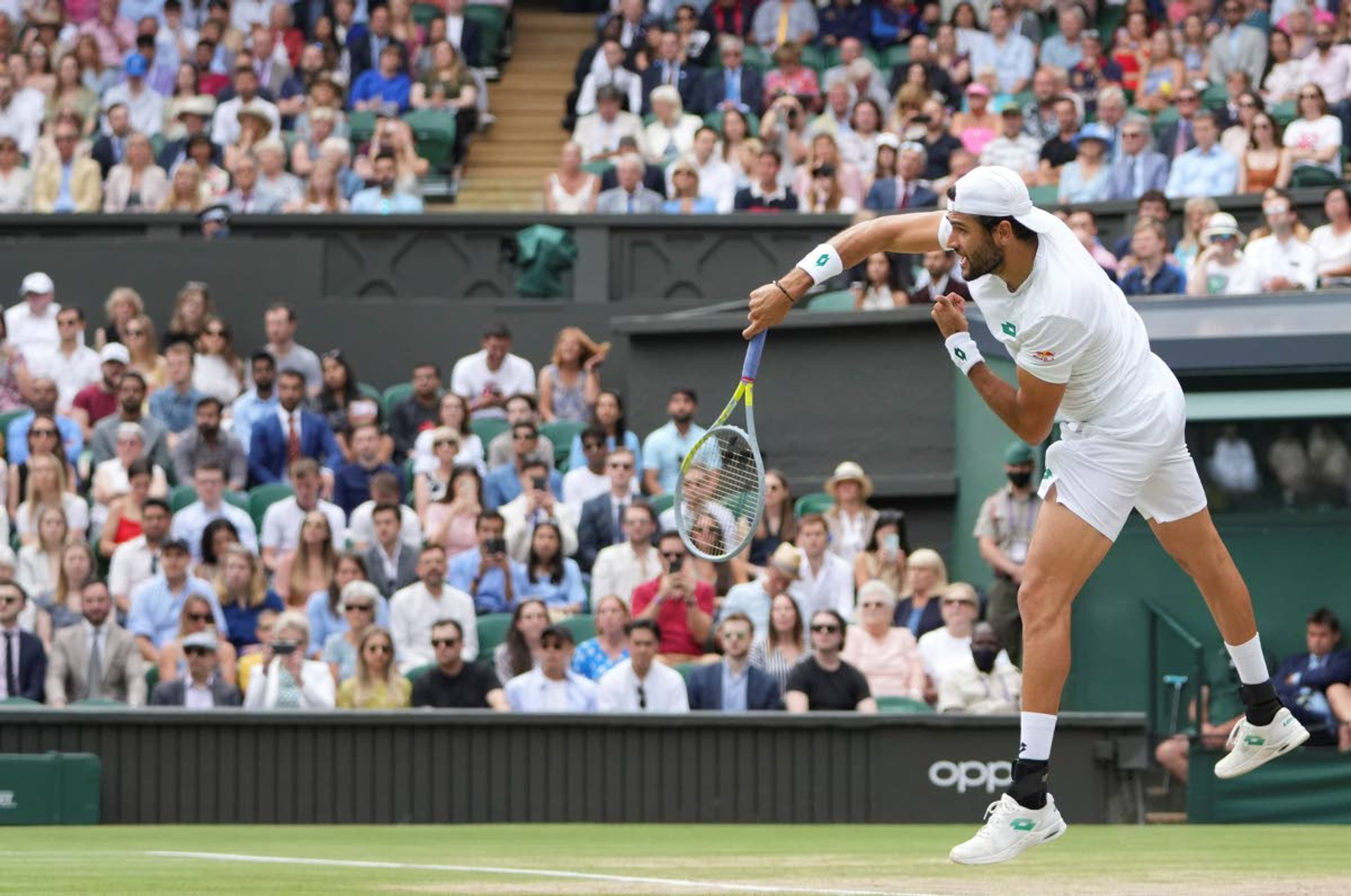 Italy's Matteo Berrettini plays a return to Poland's Hubert Hurkacz during the men's singles semifinals match on day eleven of the Wimbledon Tennis Championships in London, Friday, July 9, 2021. (AP Photo/Alberto Pezzali)