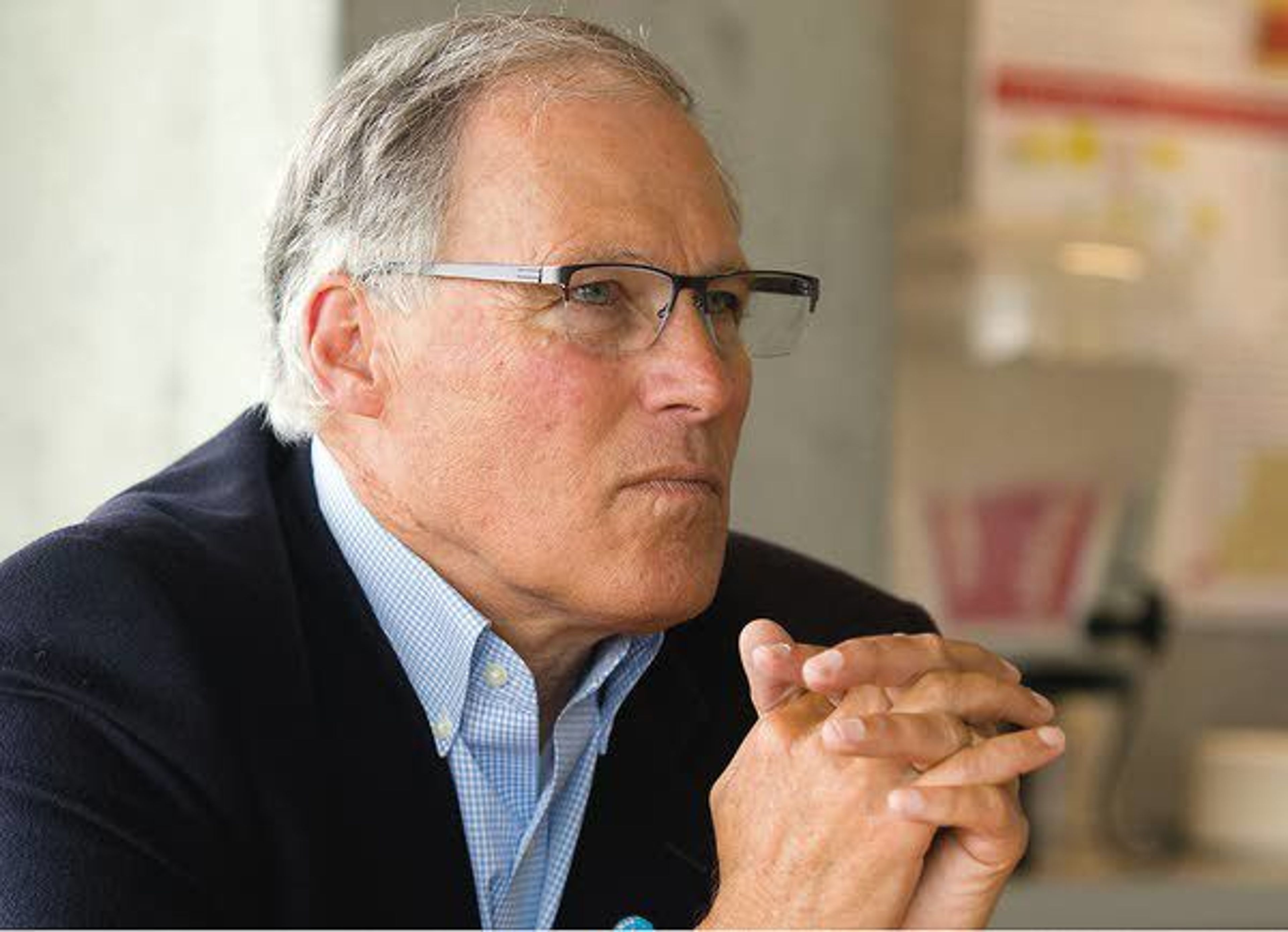 Washington Gov. Jay Inslee listens to a speaker during a meeting at Washington State University as part of his statewide broadband access tour Wednesday in Pullman.