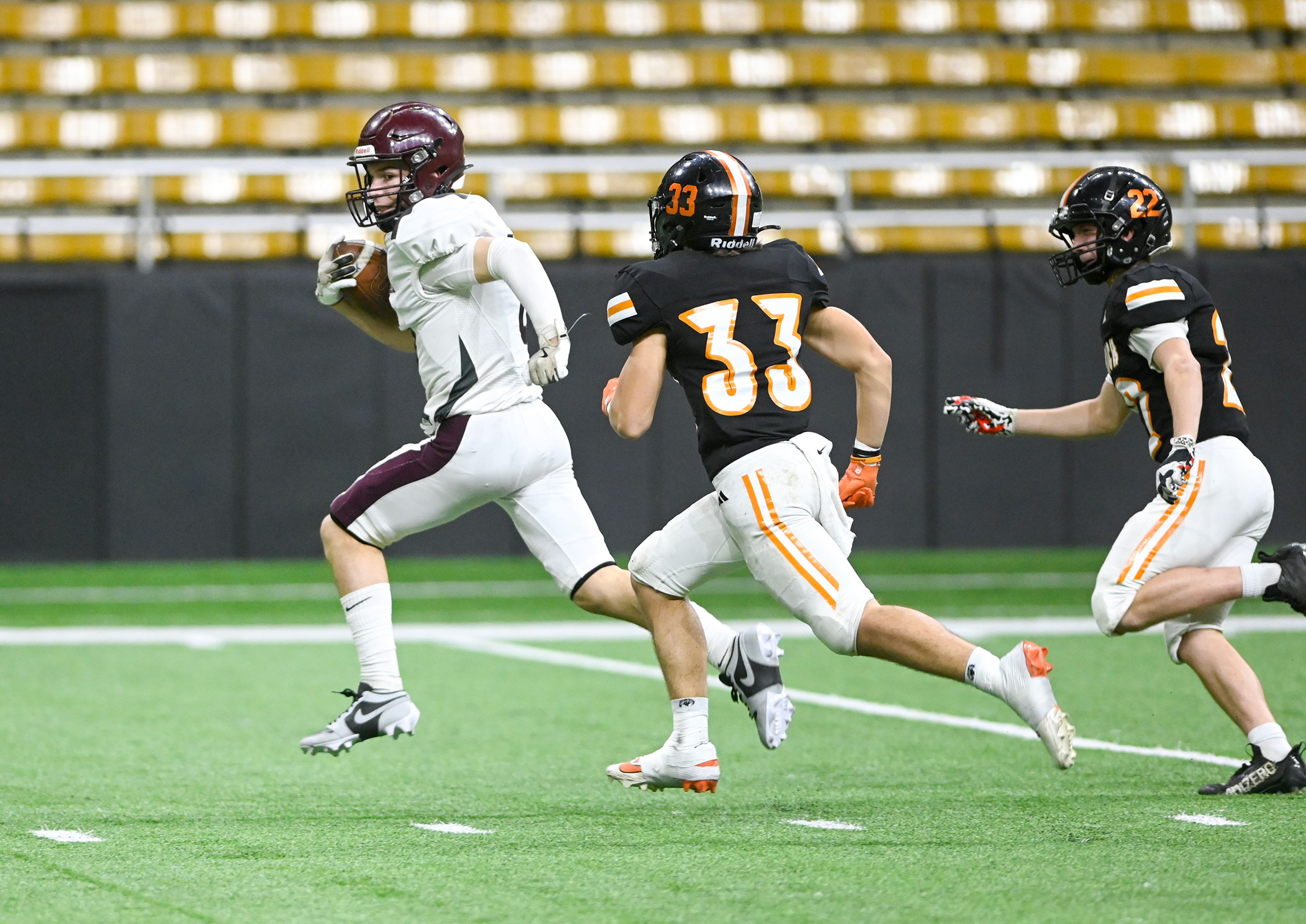 Kamiah’s Lawson Landmark outruns Kendrick defenders in a breakaway touchdown play during an Idaho Class 2A state quarterfinal game at the P1FCU Kibbie Dome in Moscow.